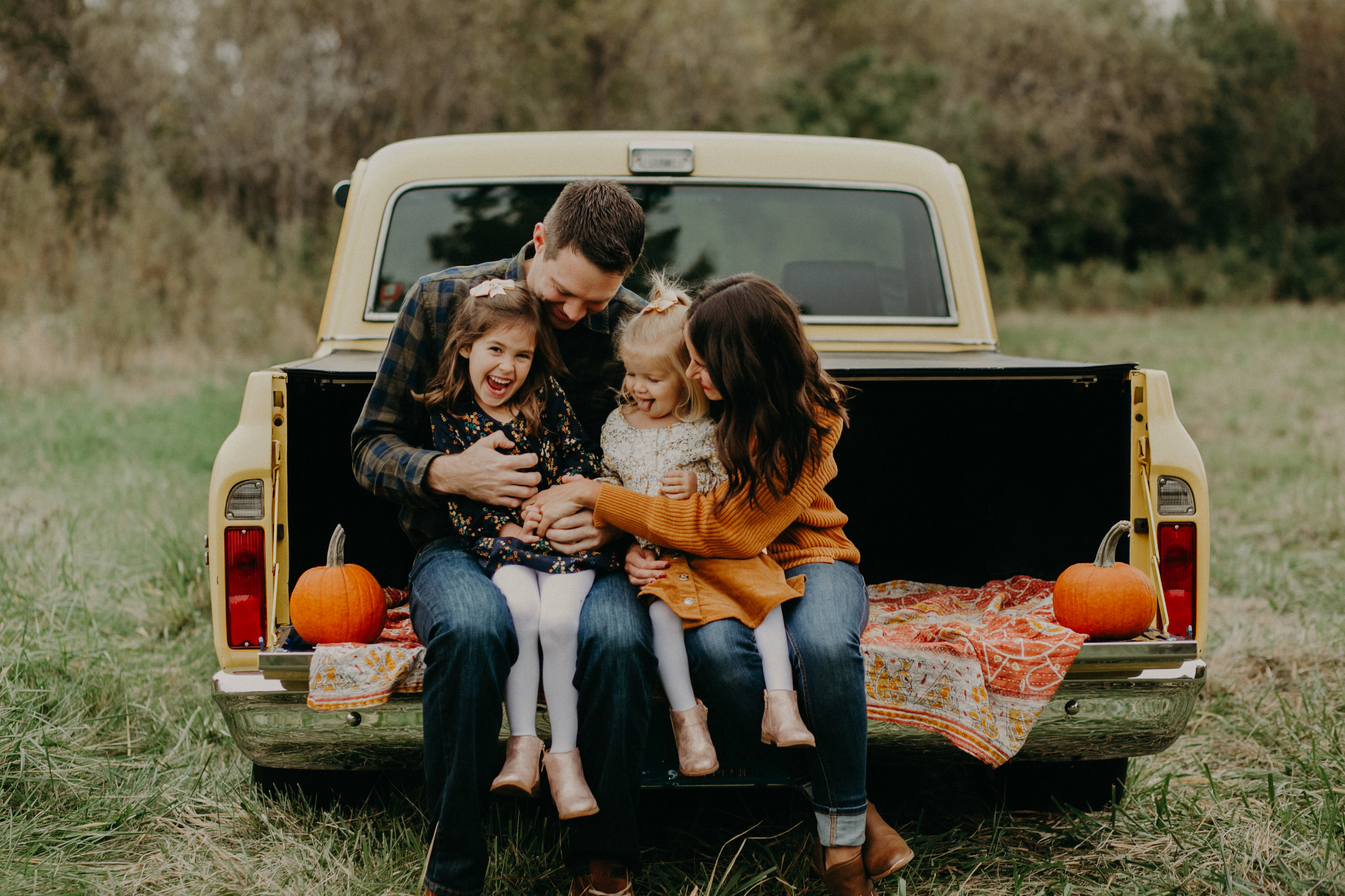  River Falls lifestyle family session sitting on a vintage truck 
