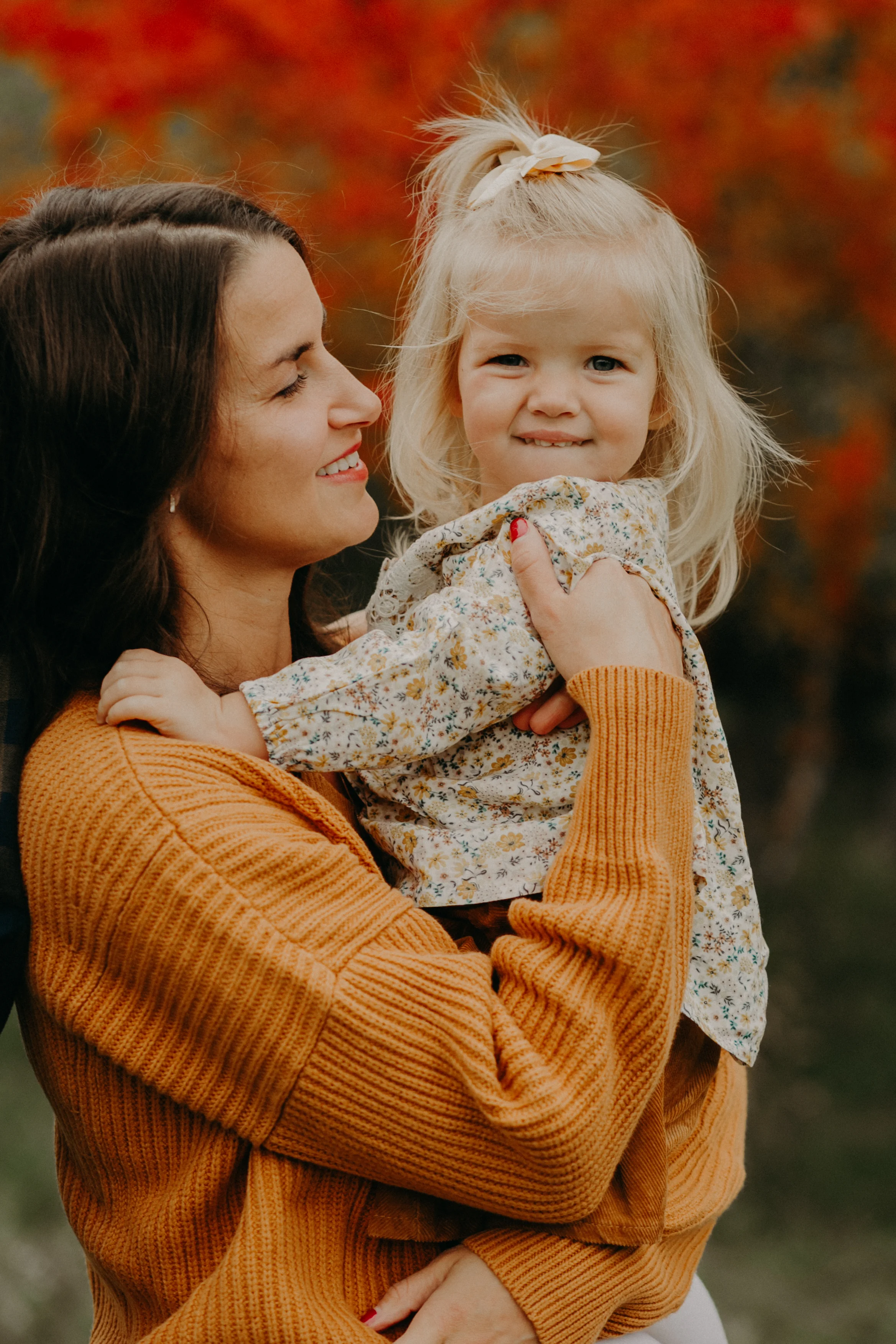 mommy and daughter pose during lifestyle family session by Andrea Wagner Photography