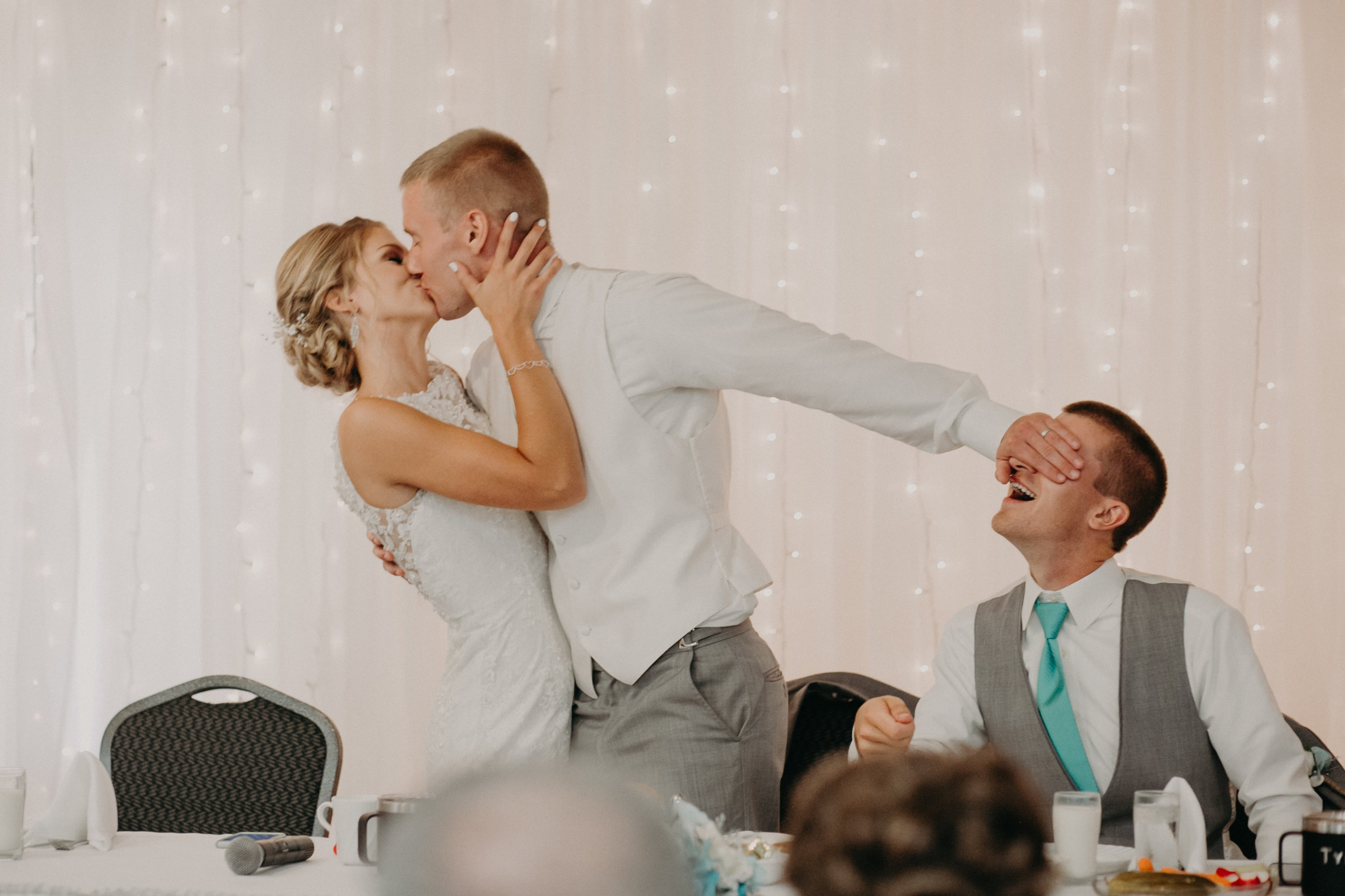 lenz-stargardt-wedding-reception-eagles-club-kissing-bride-groom