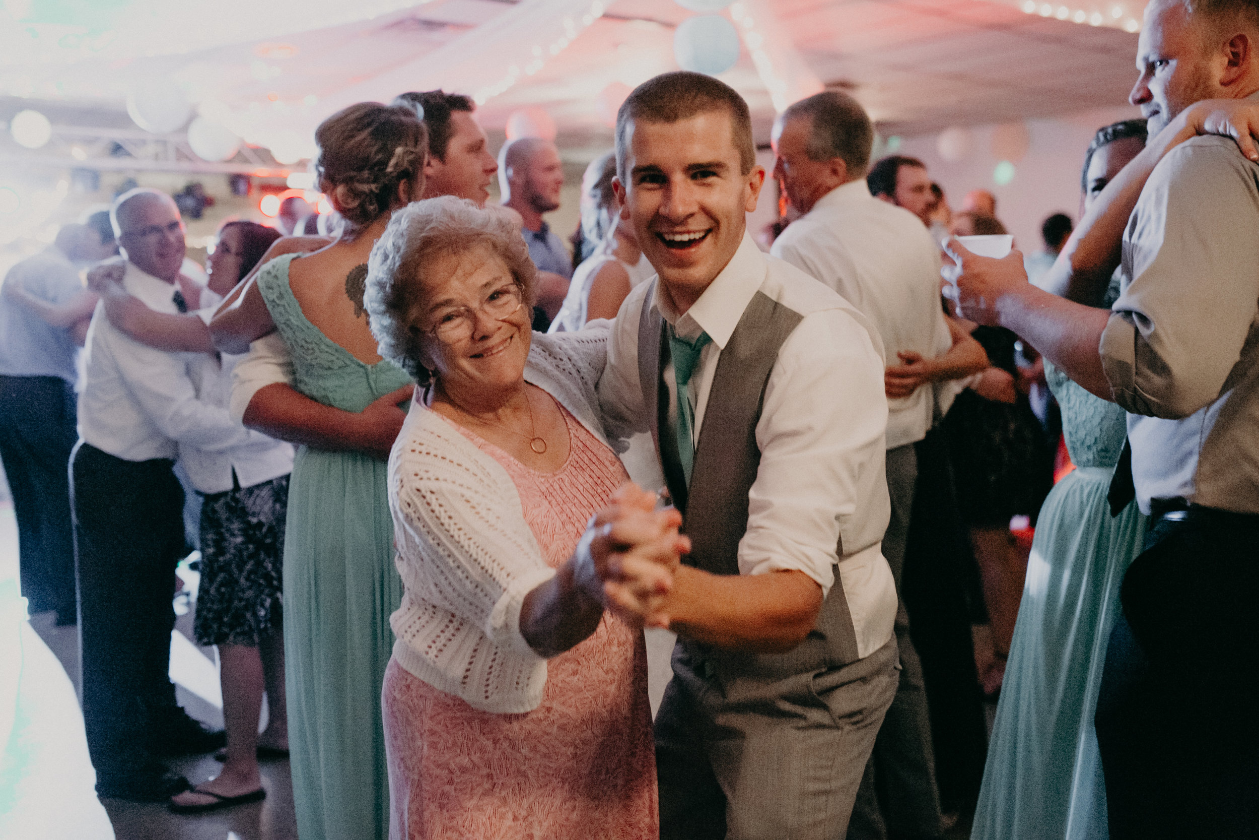 Travis Stargardt dances with family at wedding reception 