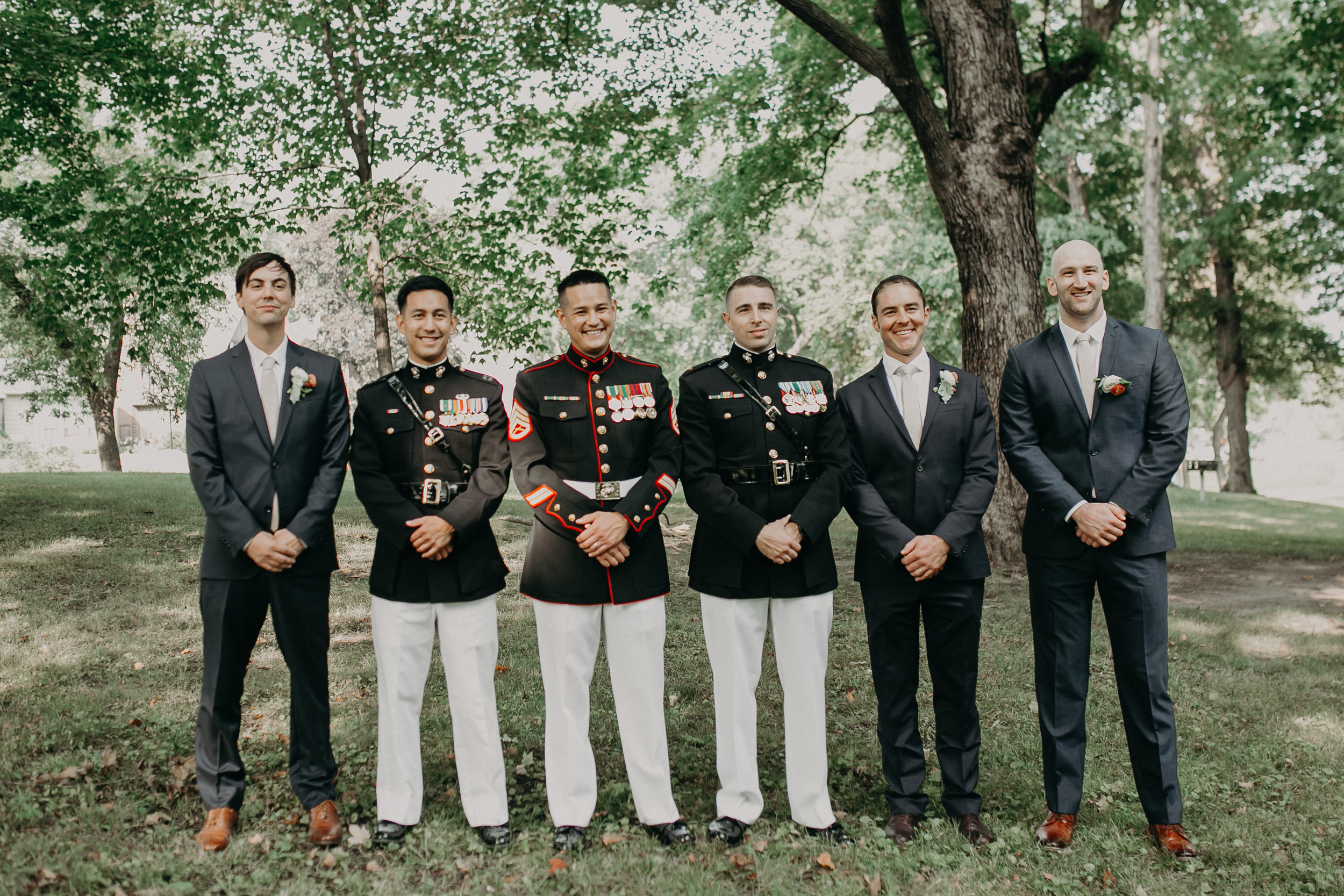  military groom and groomsmen pose for wedding portraits at 6Smith on Lake Minnetonka 