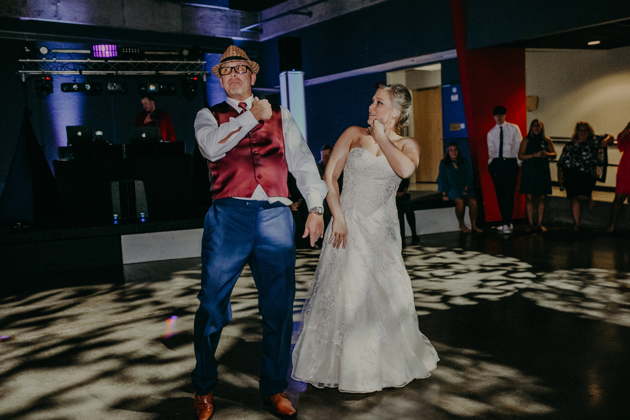 bride and Father of the bride dance during wedding reception in Falcon Room at UWRF
