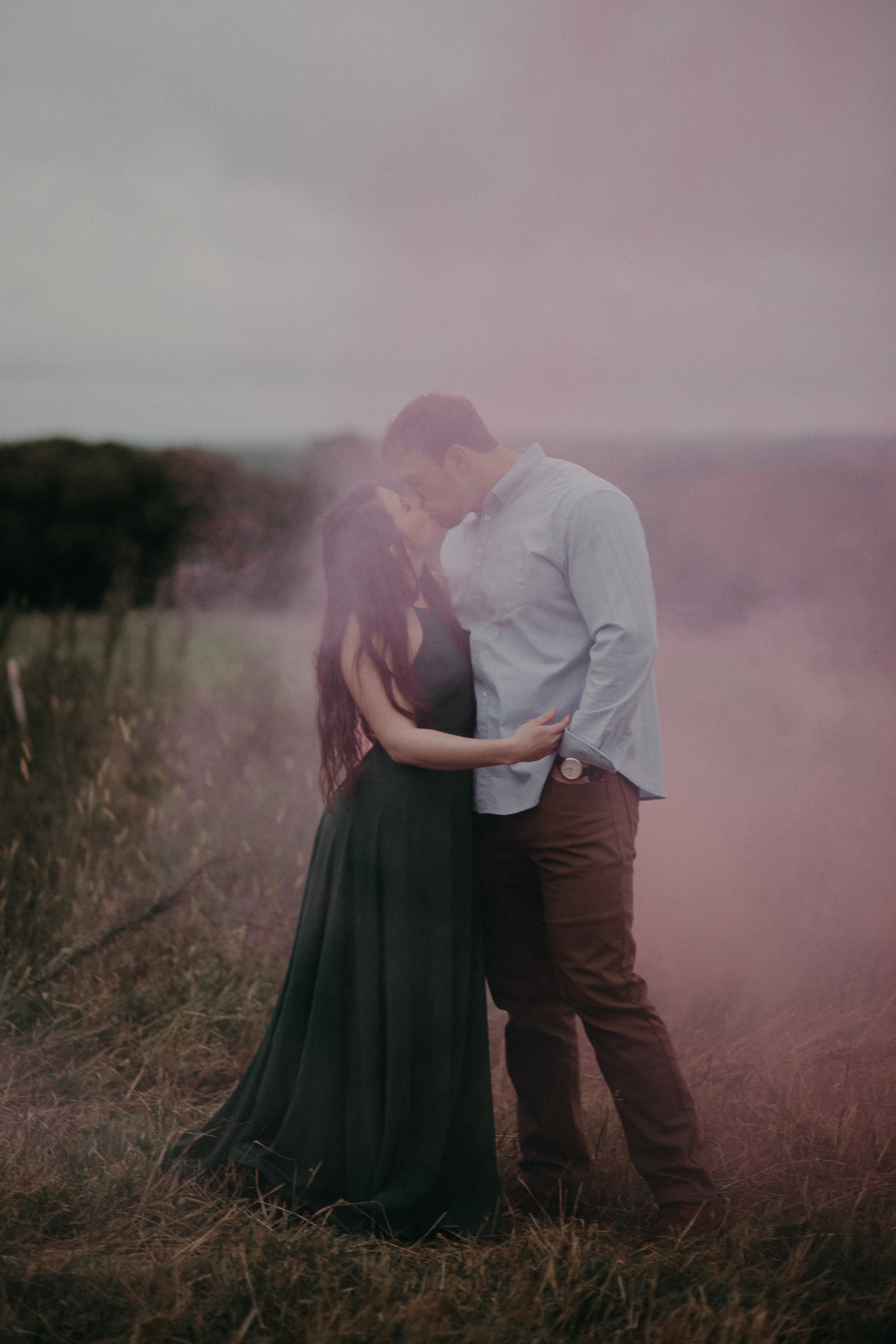  An engagement session with smoke bombs by the St Croix River in Hastings MN 