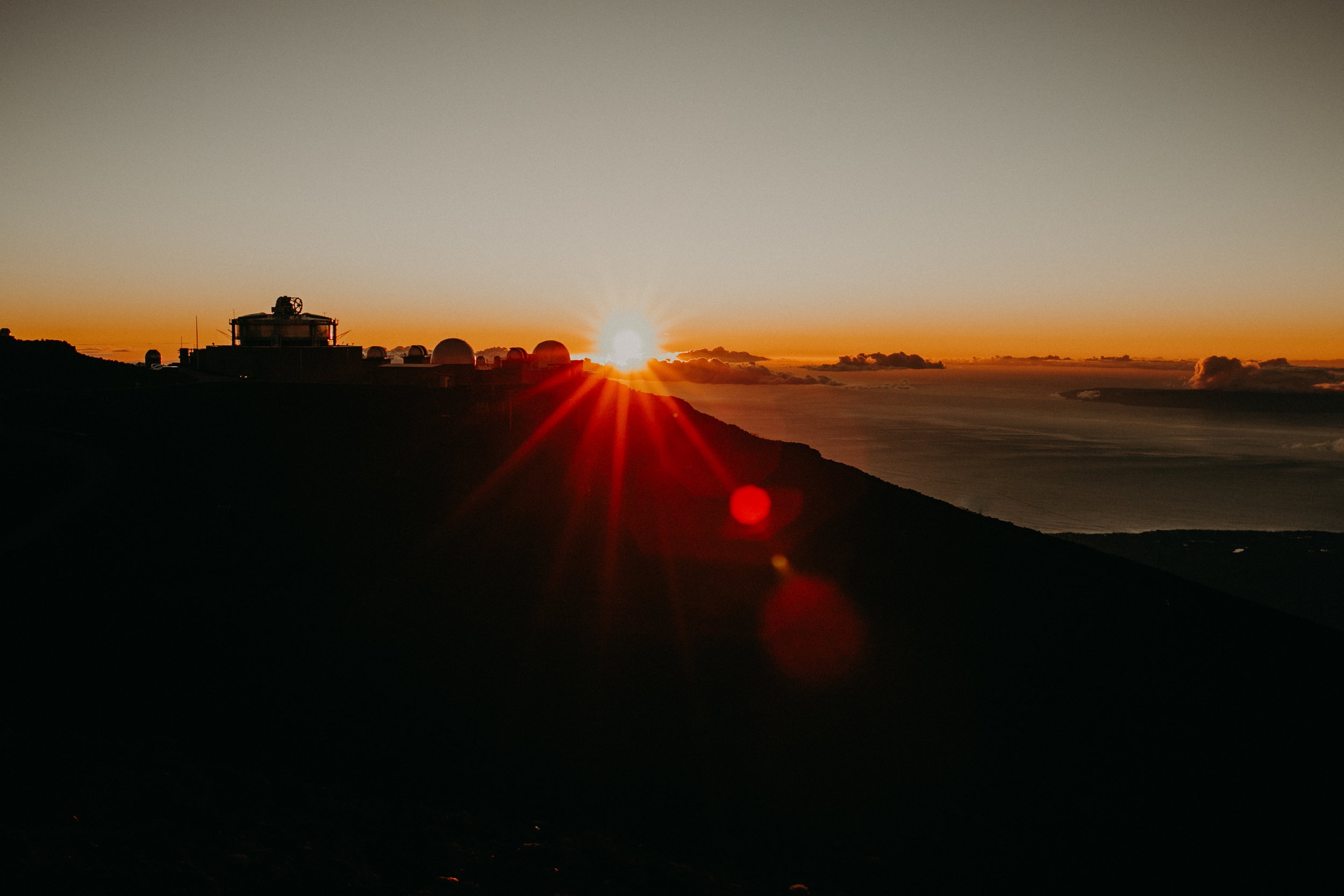  orange sunset from high altitude from West side of the Haleakala Crater 