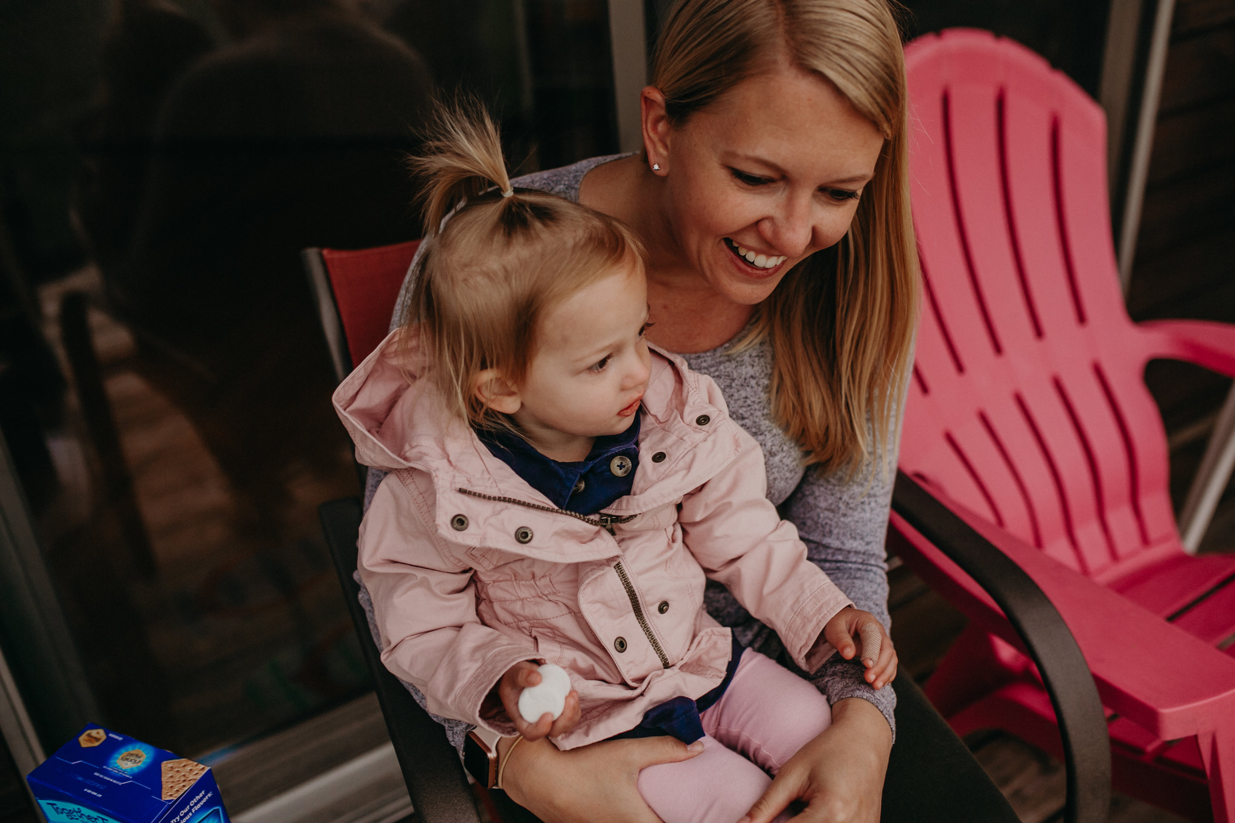 happy family on Madeline Island eats marshmallows during a family photo shoot