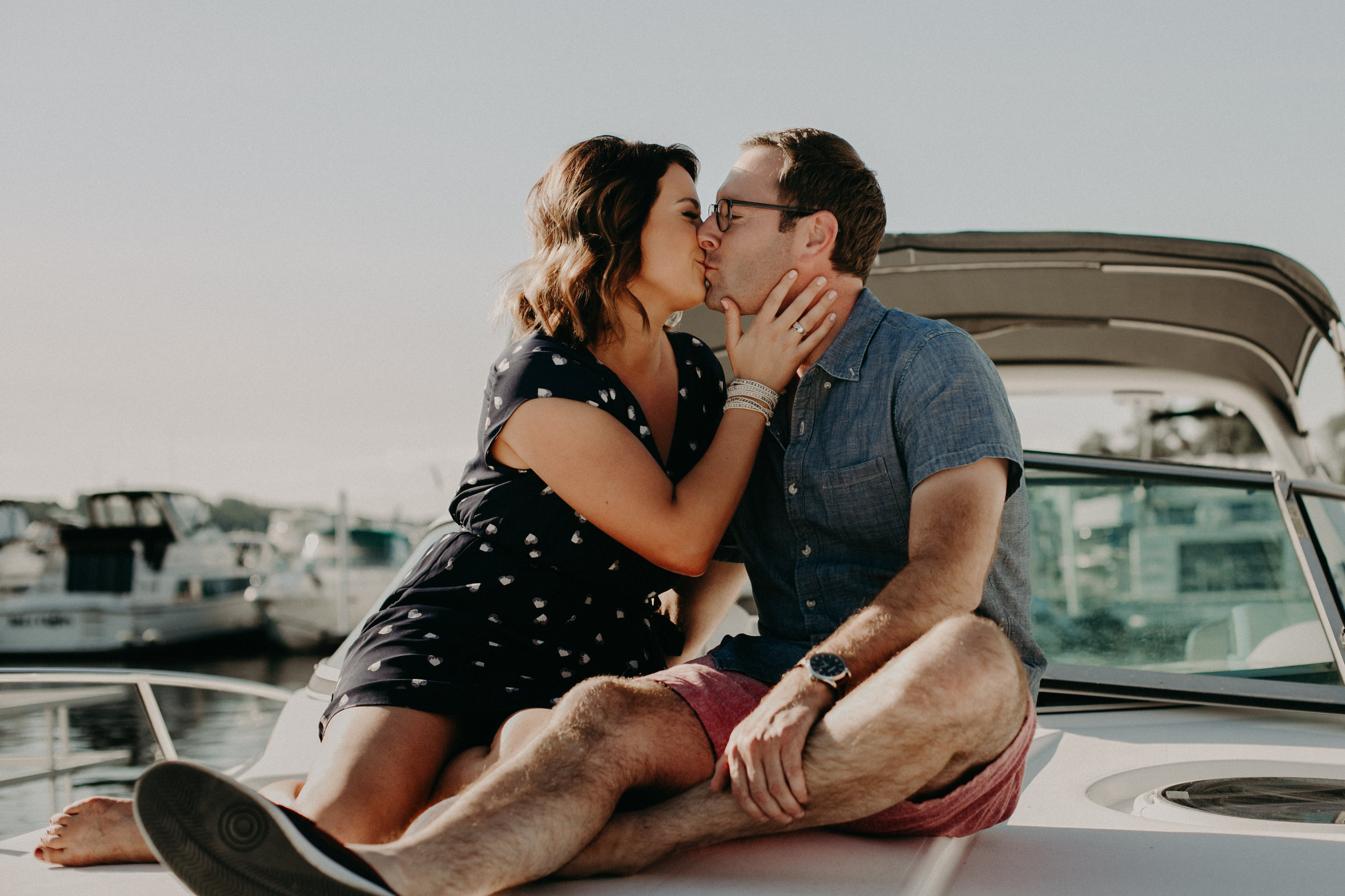a couple kisses during their engagement session with Andrea Wagner Photography on the St Croix River