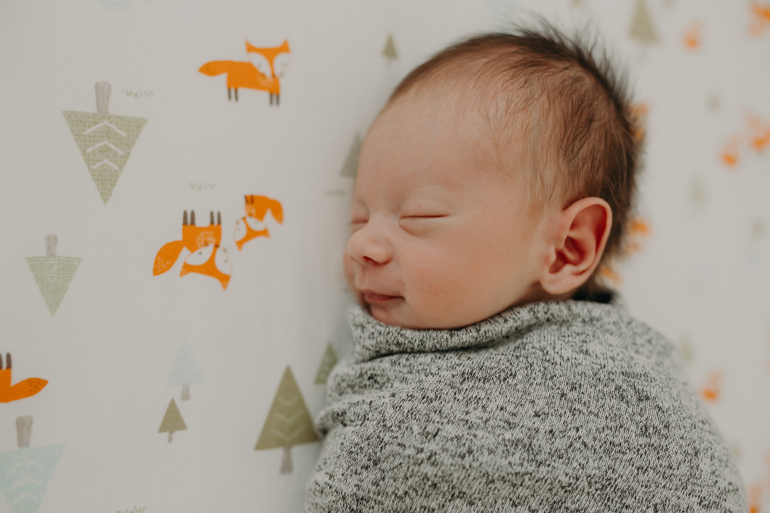 sleepy newborn photographed by Andrea Wagner Photography in Wausau WI