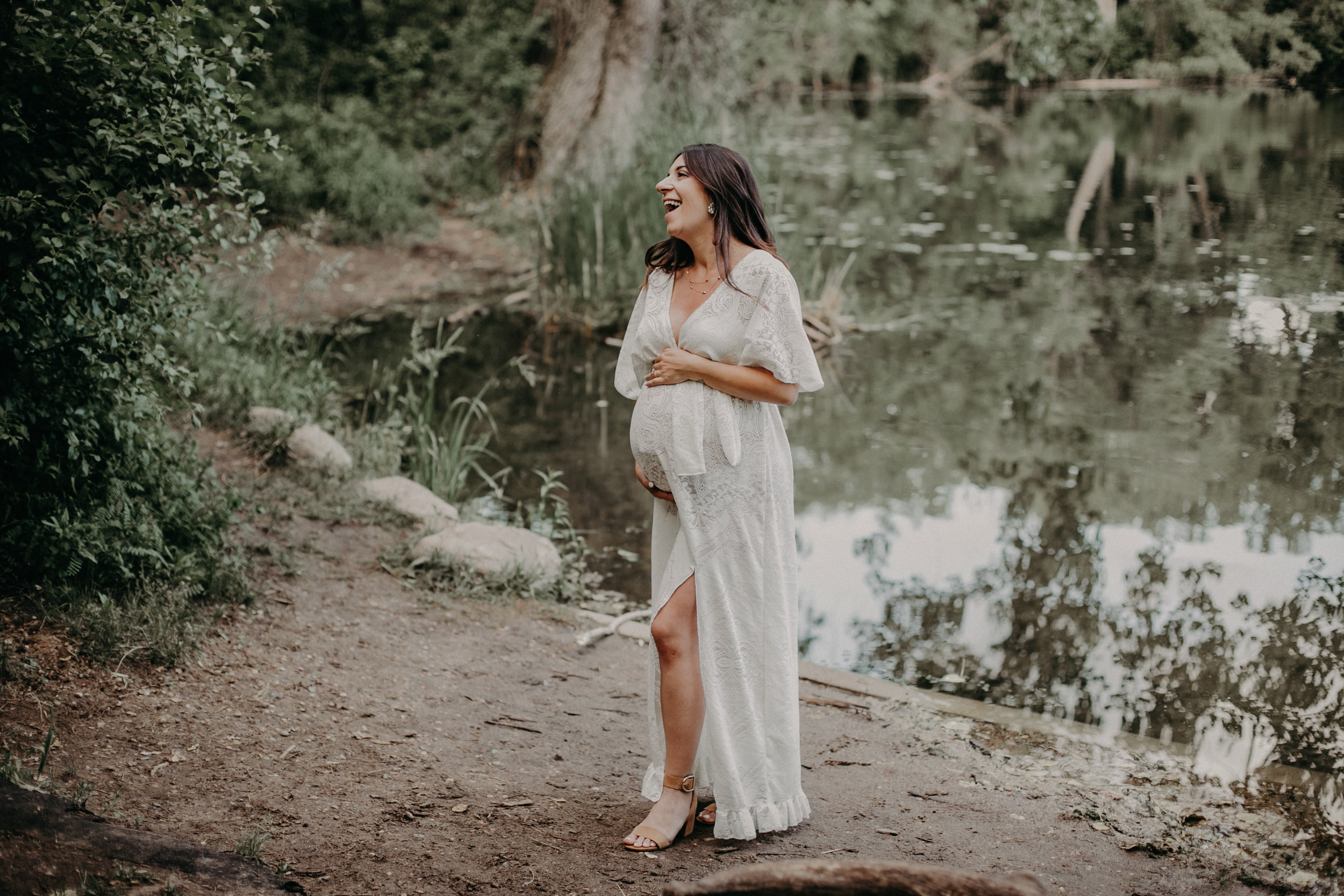  Minneapolis waterfront maternity session with blogger wearing a lace white dress 