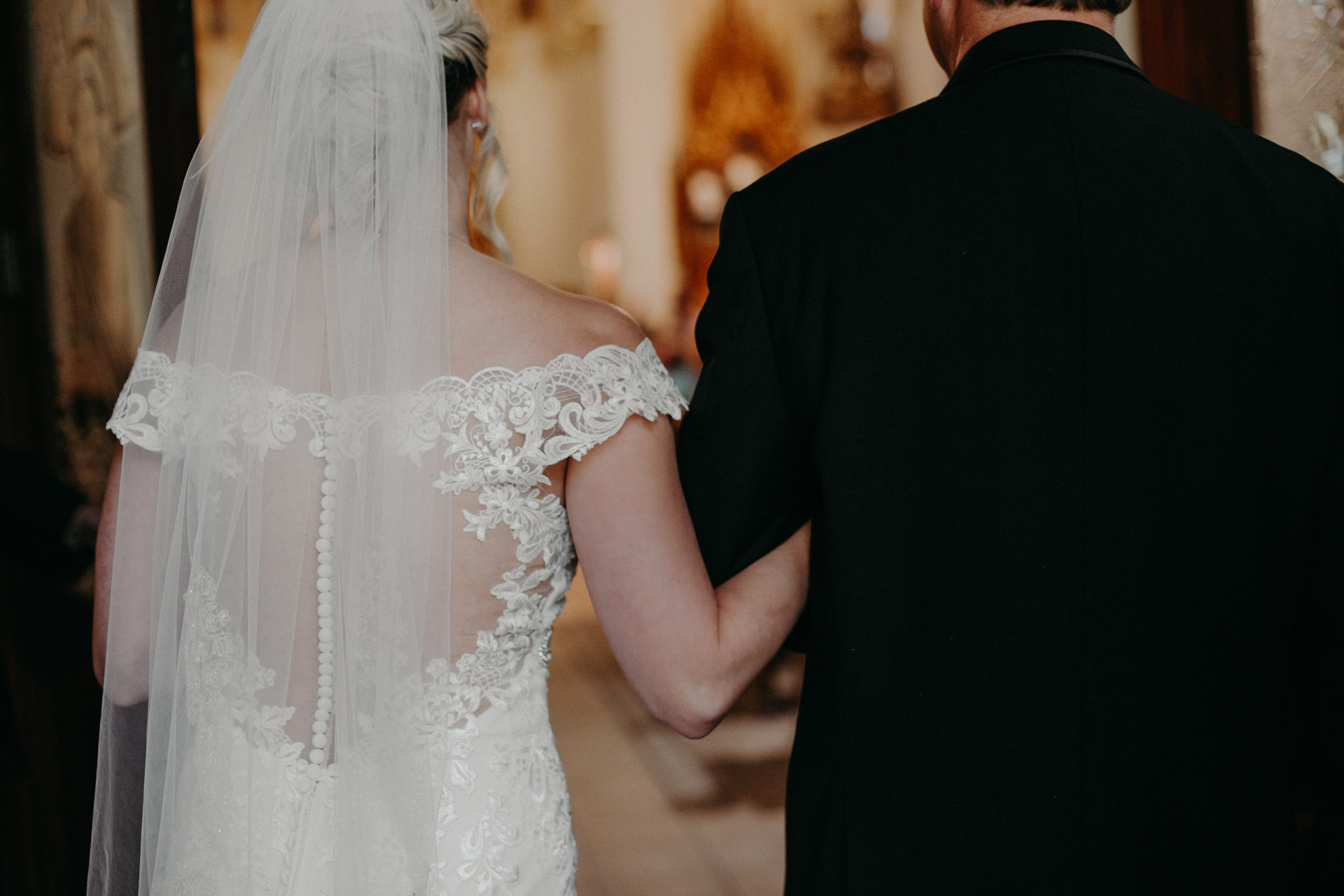 Marshfield WI wedding photographer Andrea Wagner captures bride walking down the aisle to her groom