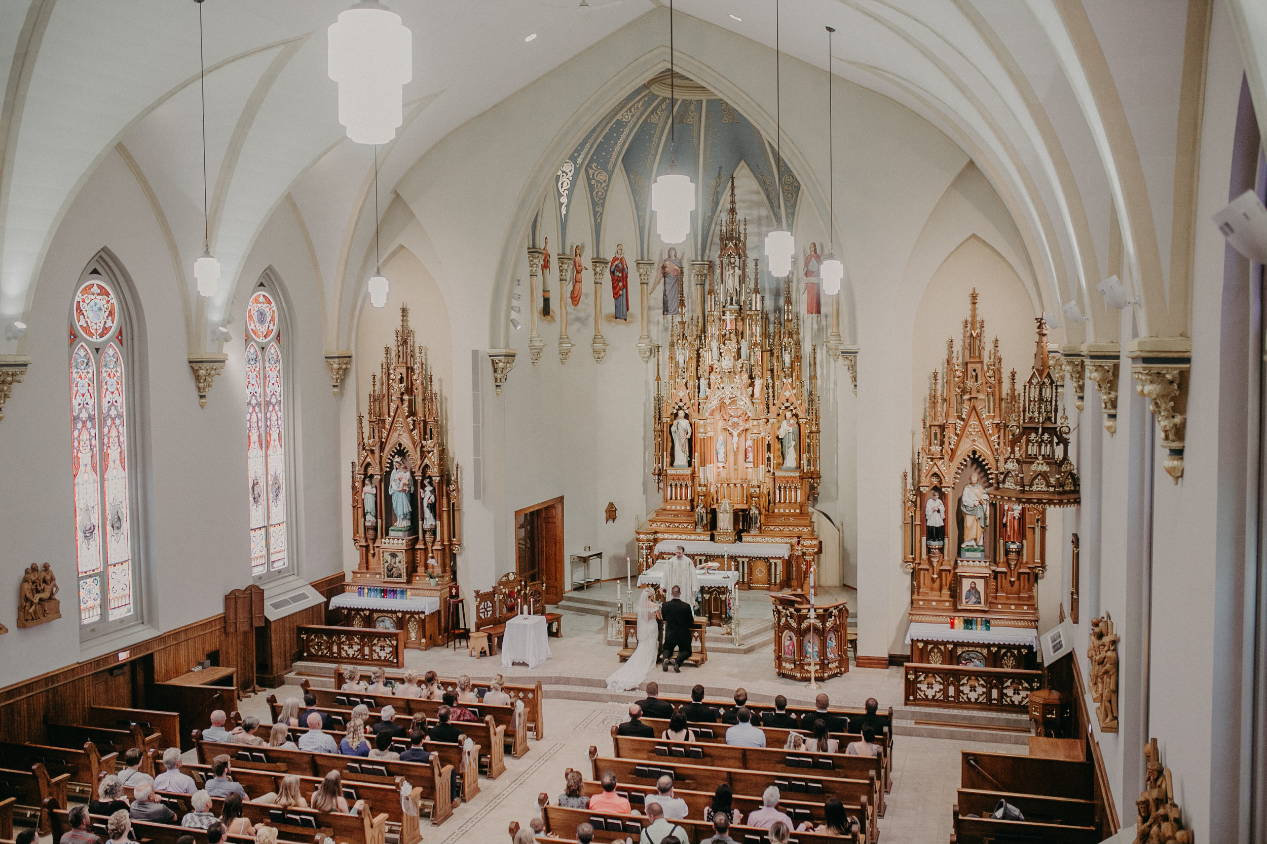  Marshfield WI wedding photographer Andrea Wagner photographs natural light in Catholic wedding ceremony 