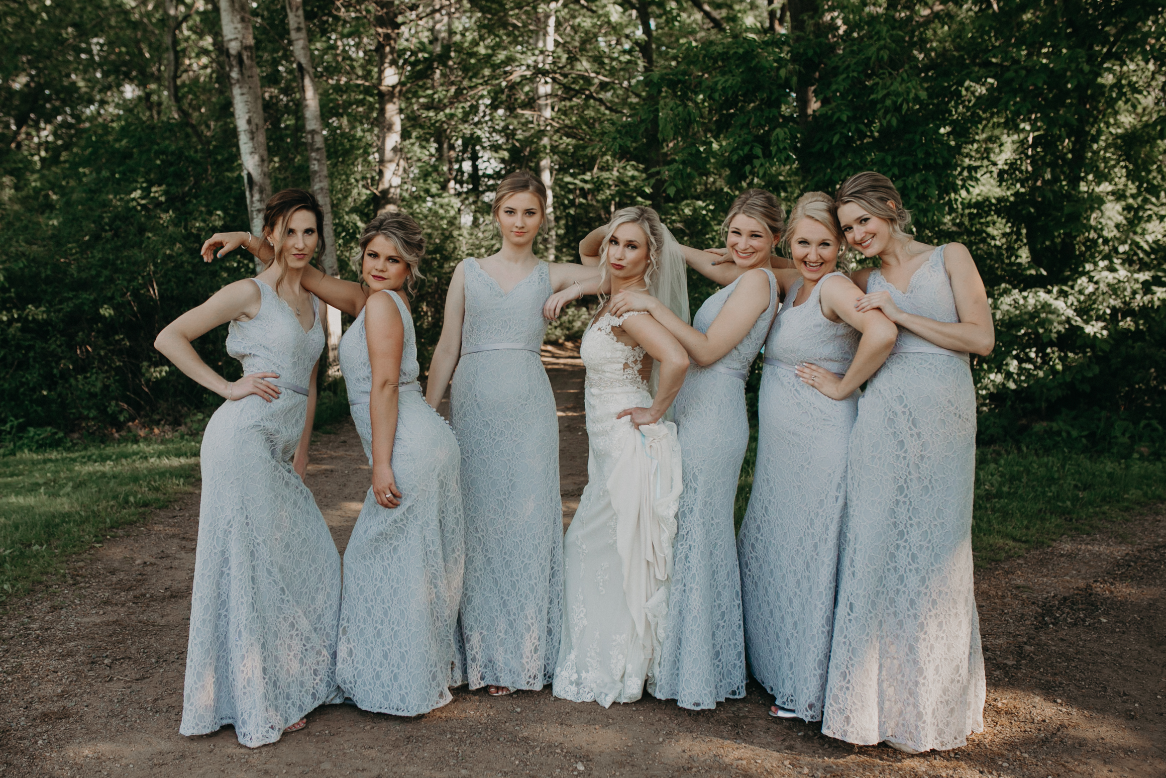  bad ass group of girls in wedding party posing for Andrea Wagner Photography’s camera during a Marshfield WI wedding at RiverEdge 