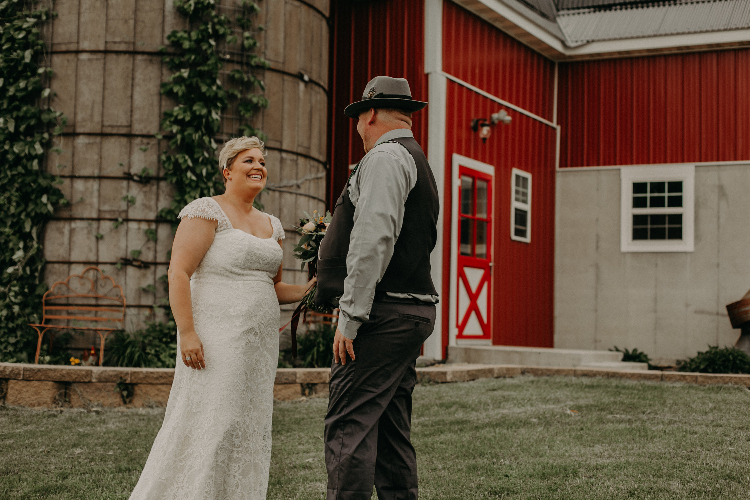 bride and groom enjoy their first look with Andrea Wagner Photography at their wedding in Ellsworth WI