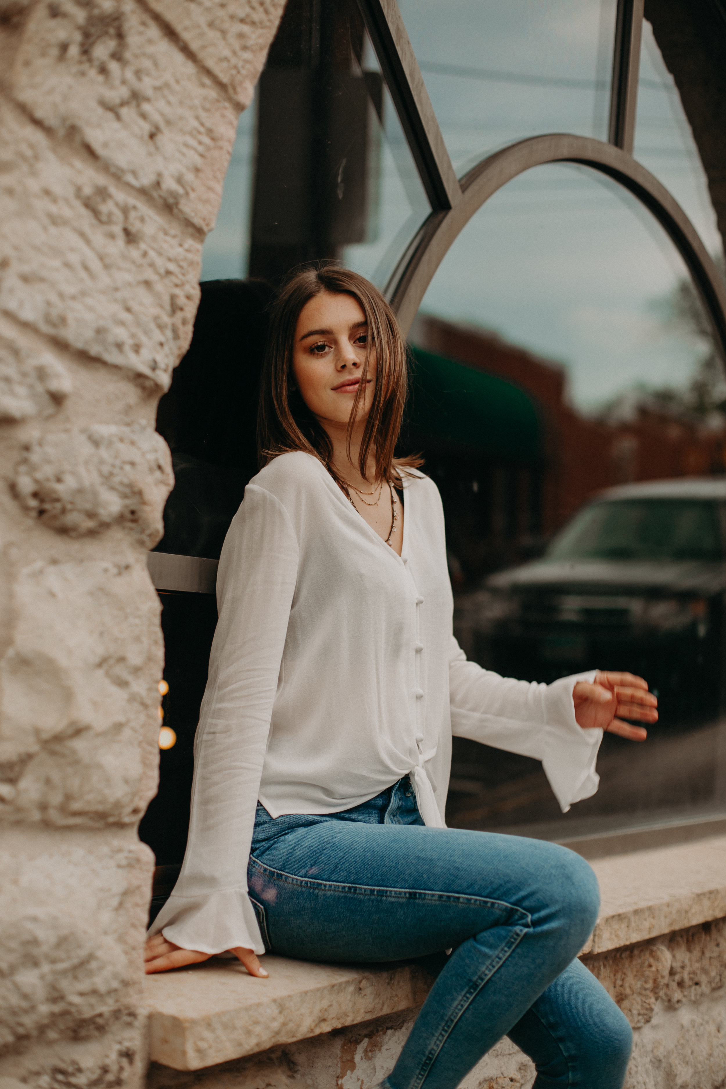  beautiful girl poses for her senior photos in downtown Stillwater MN 