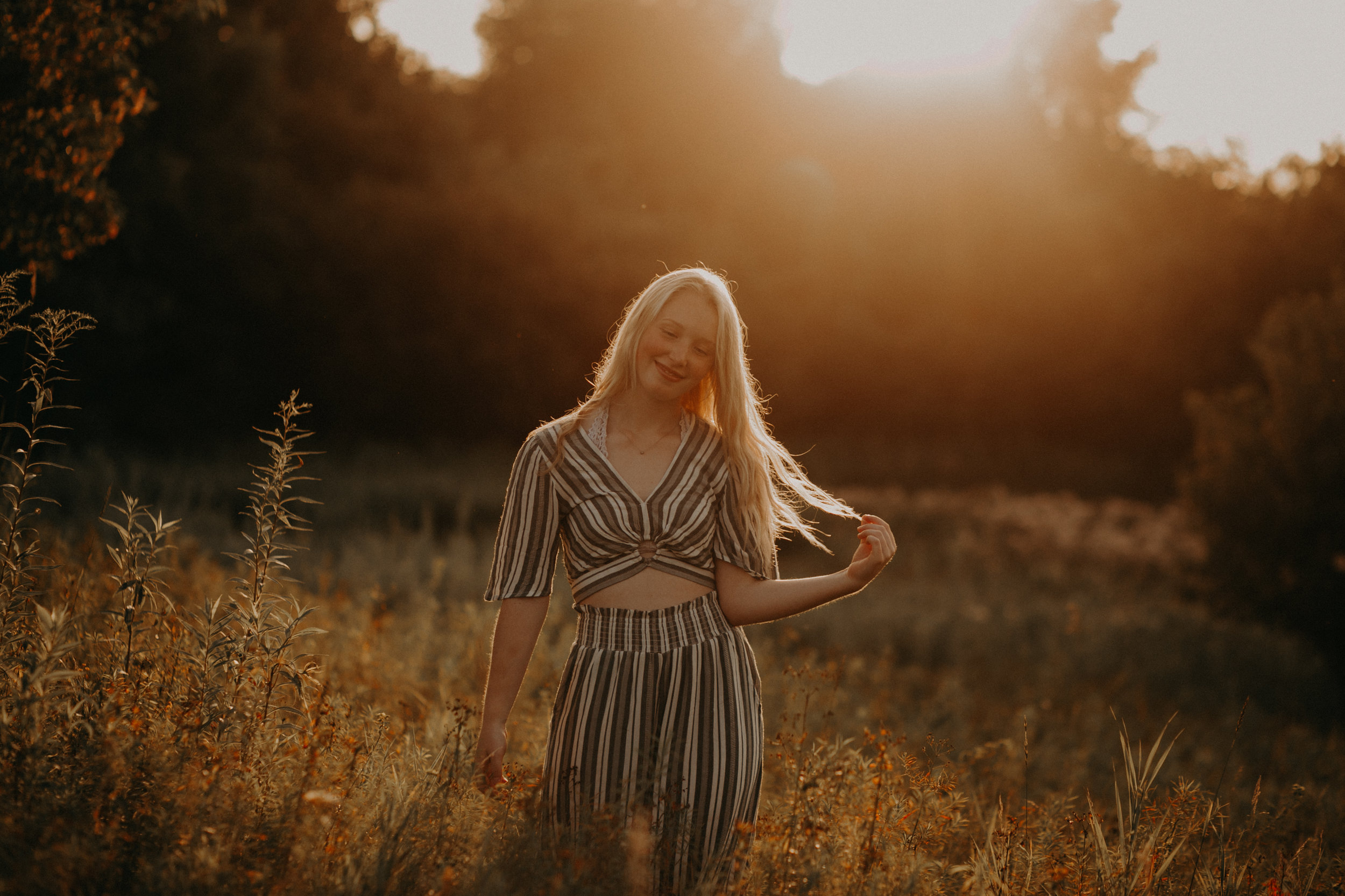 magical golden light at sunset during a Hudson WI senior photo shoot