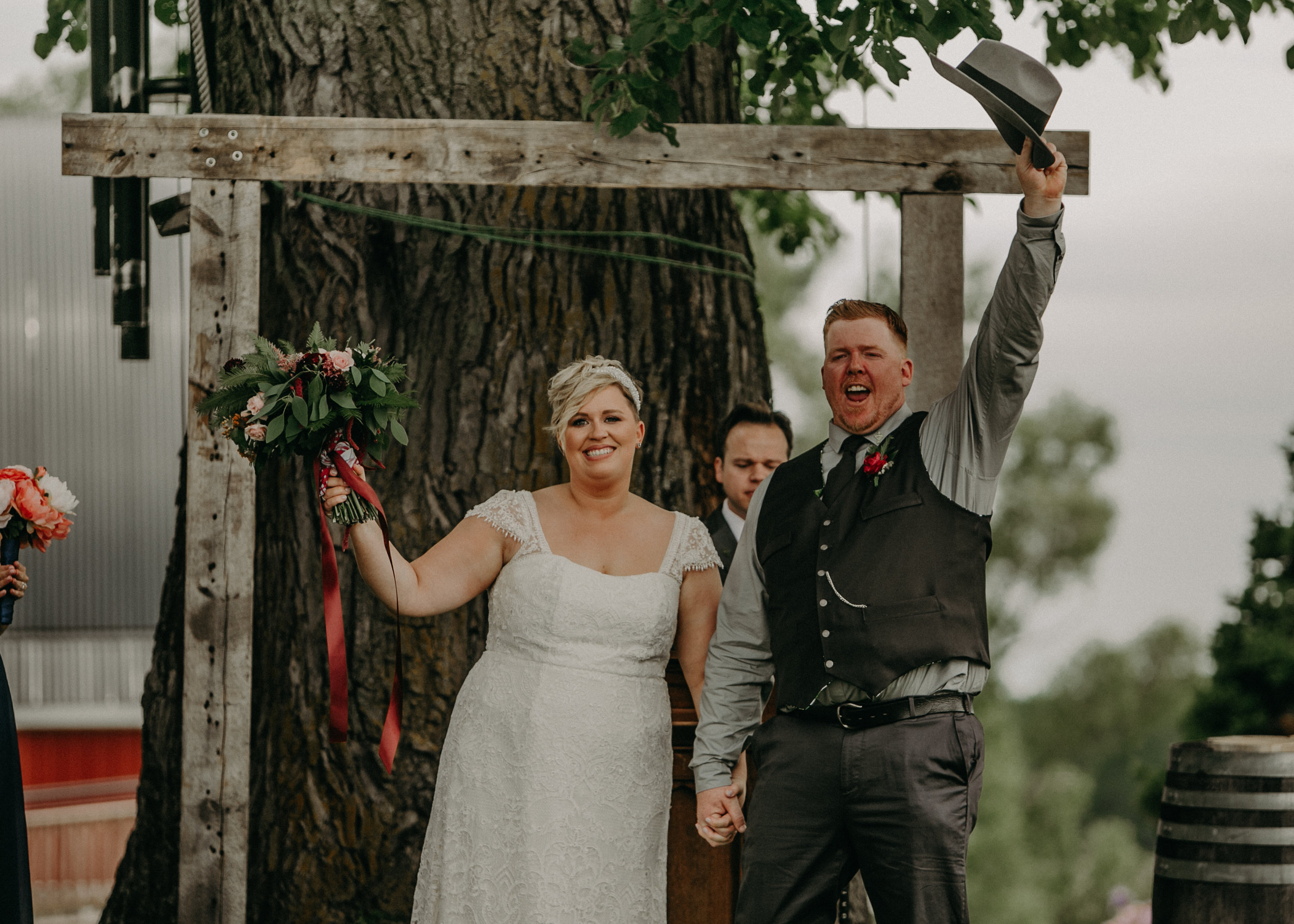  a bride and groom are married at Jean Acres Barn in Ellsworth WI 