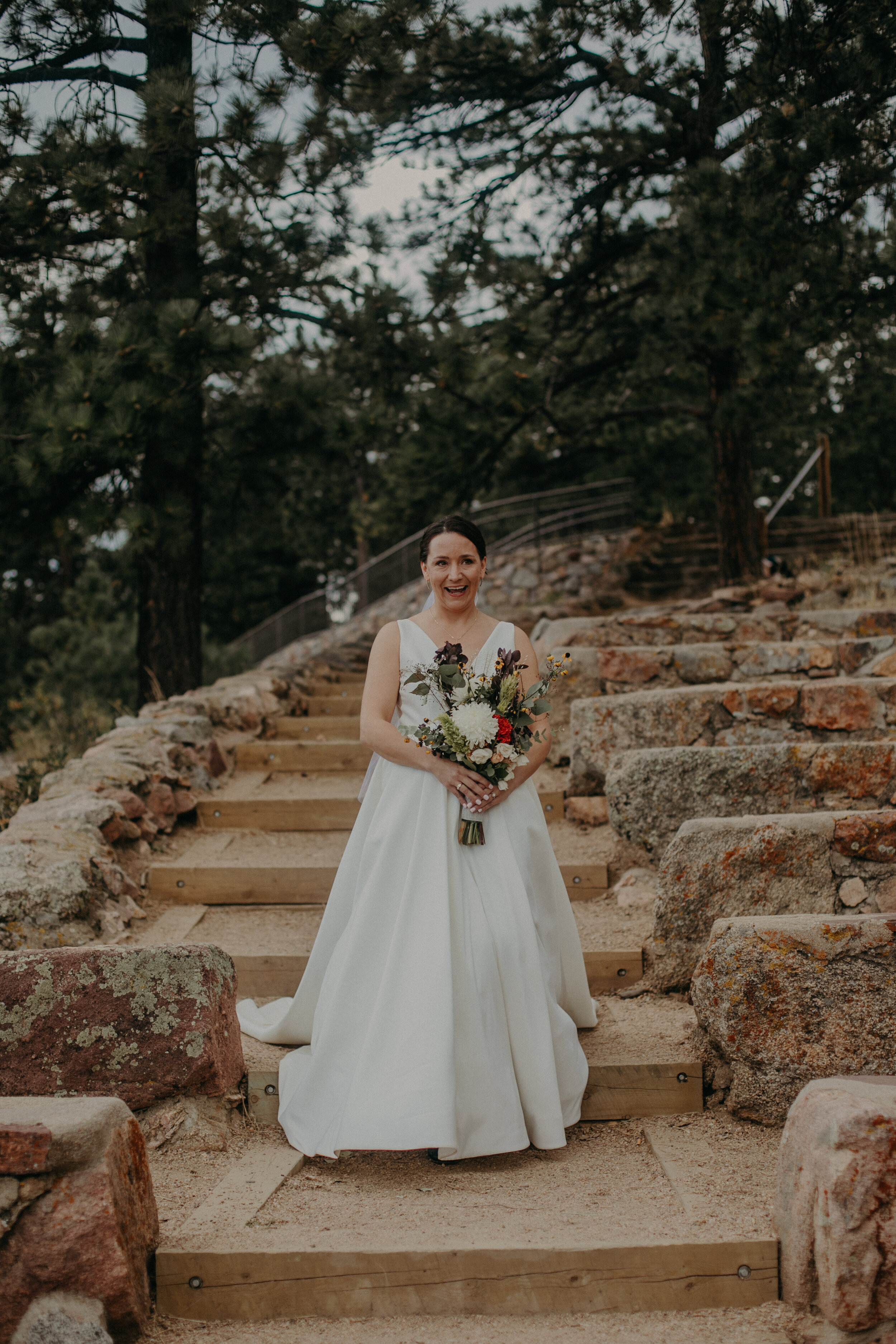  a bride walks down the steps of the Sunrise Amphitheater during a fall wedding 