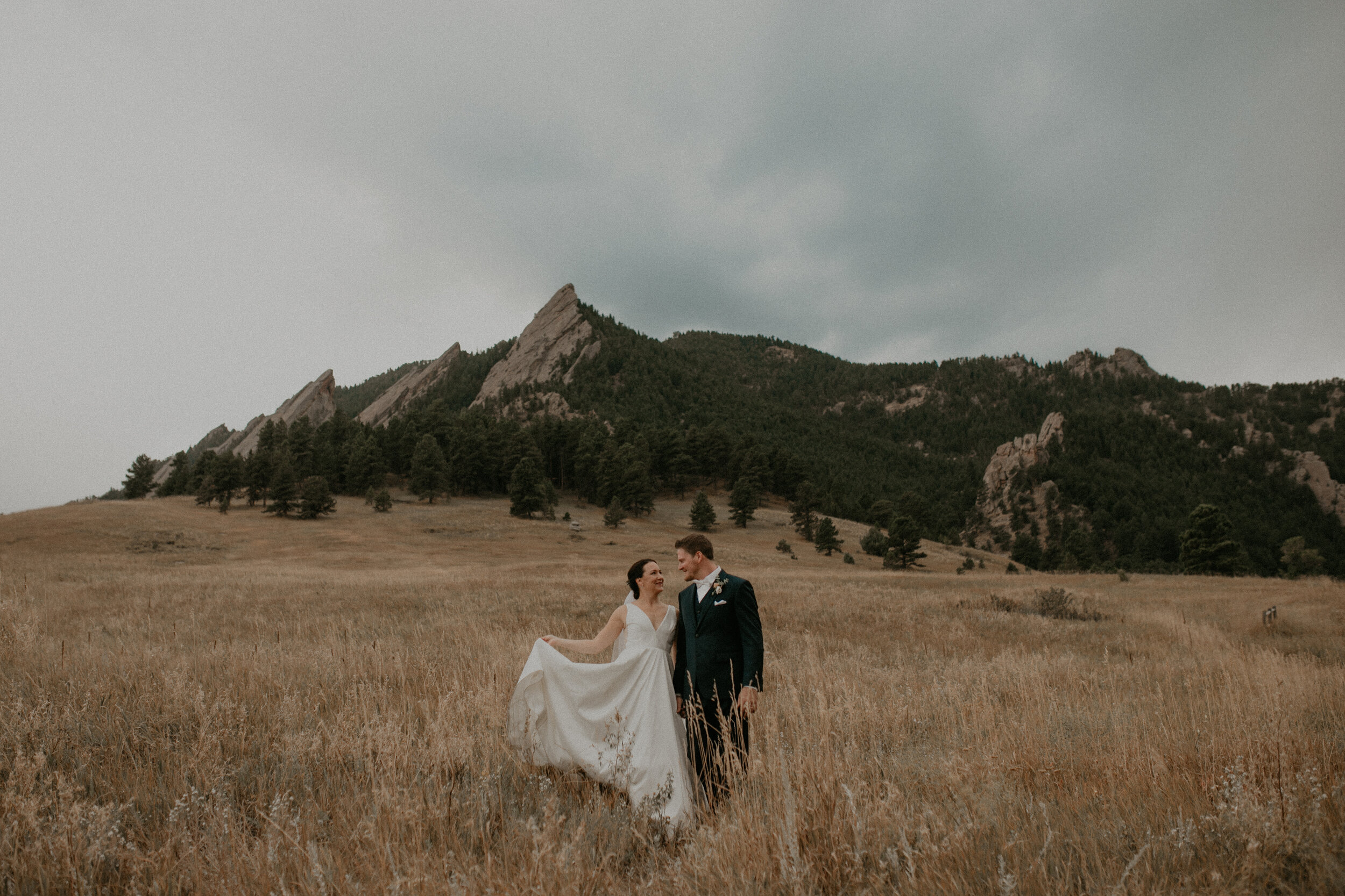  a bride and groom pose after their wedding at Chautauqua Park in Boulder CO for photos with Andrea Wagner Photography 