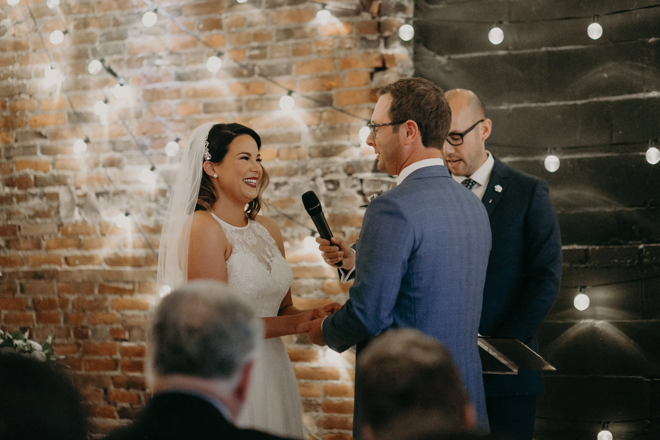 Andrea Wagner photography captures dimly lit and intimate wedding ceremony at The Loft at Studio J