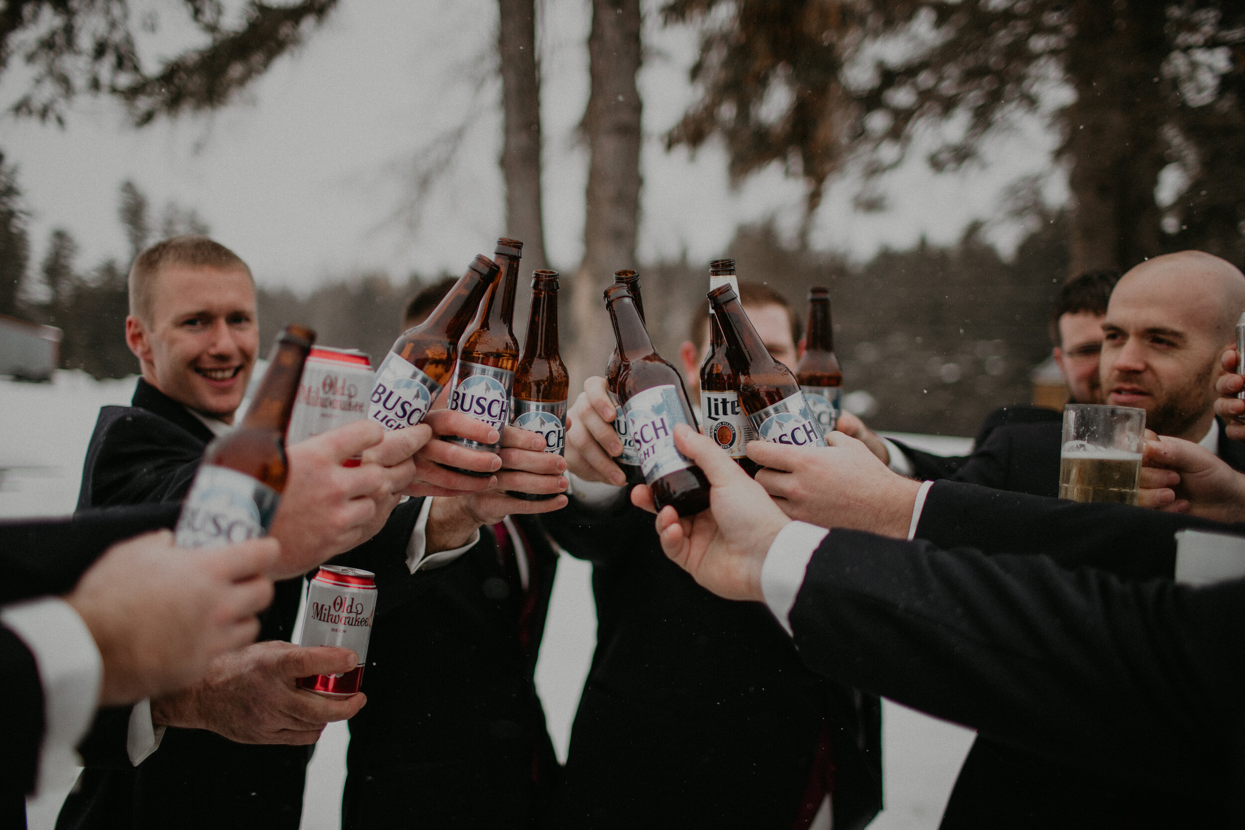  Andrea Wanger Photography cozy winter Wisconsin wedding. Perfect Wisconsin wedding in February. Elegant winter wedding groom and groomsmen. Beers and cheers! 