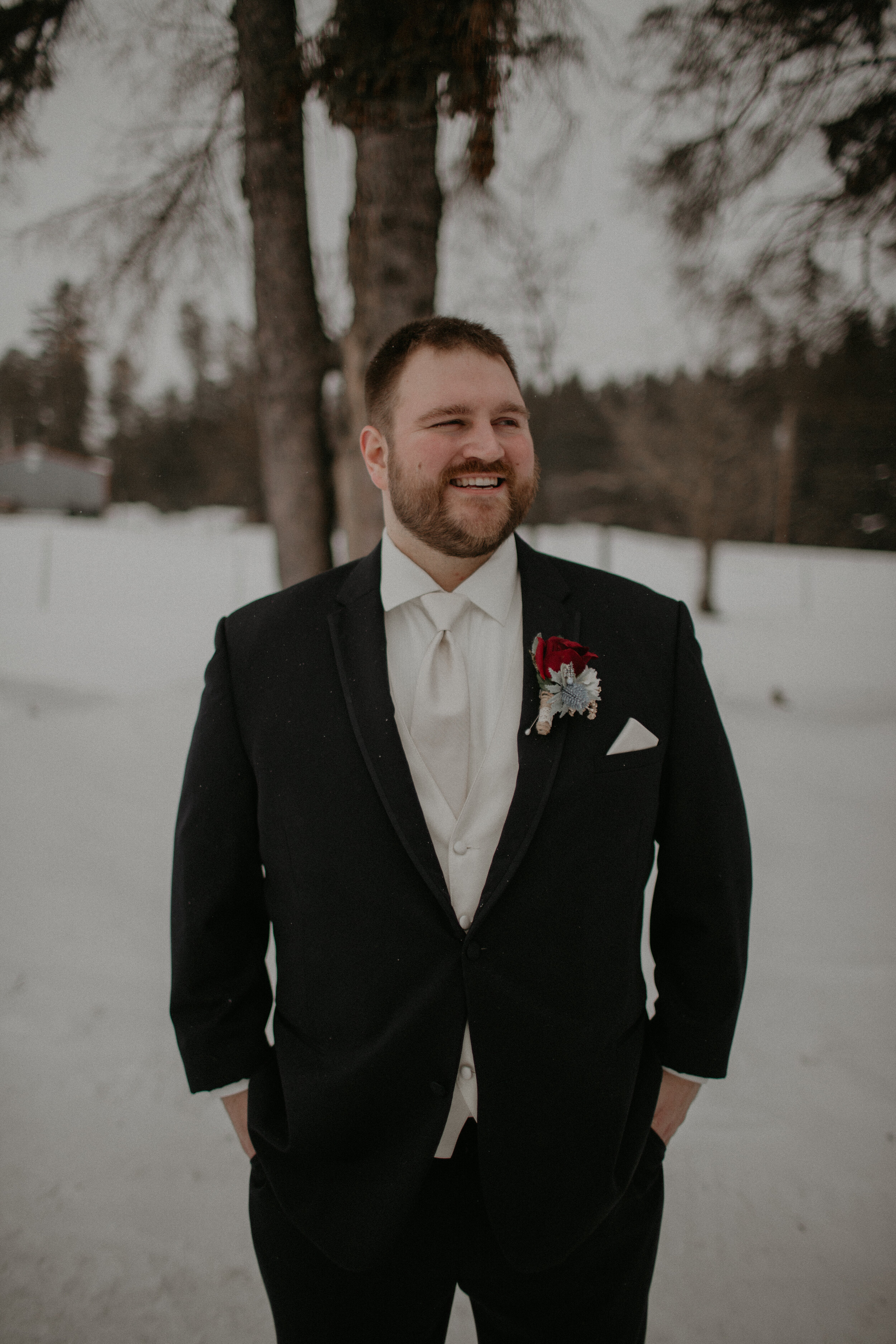  Andrea Wanger Photography cozy winter Wisconsin wedding. Perfect Wisconsin wedding in February. Elegant winter wedding groom. 