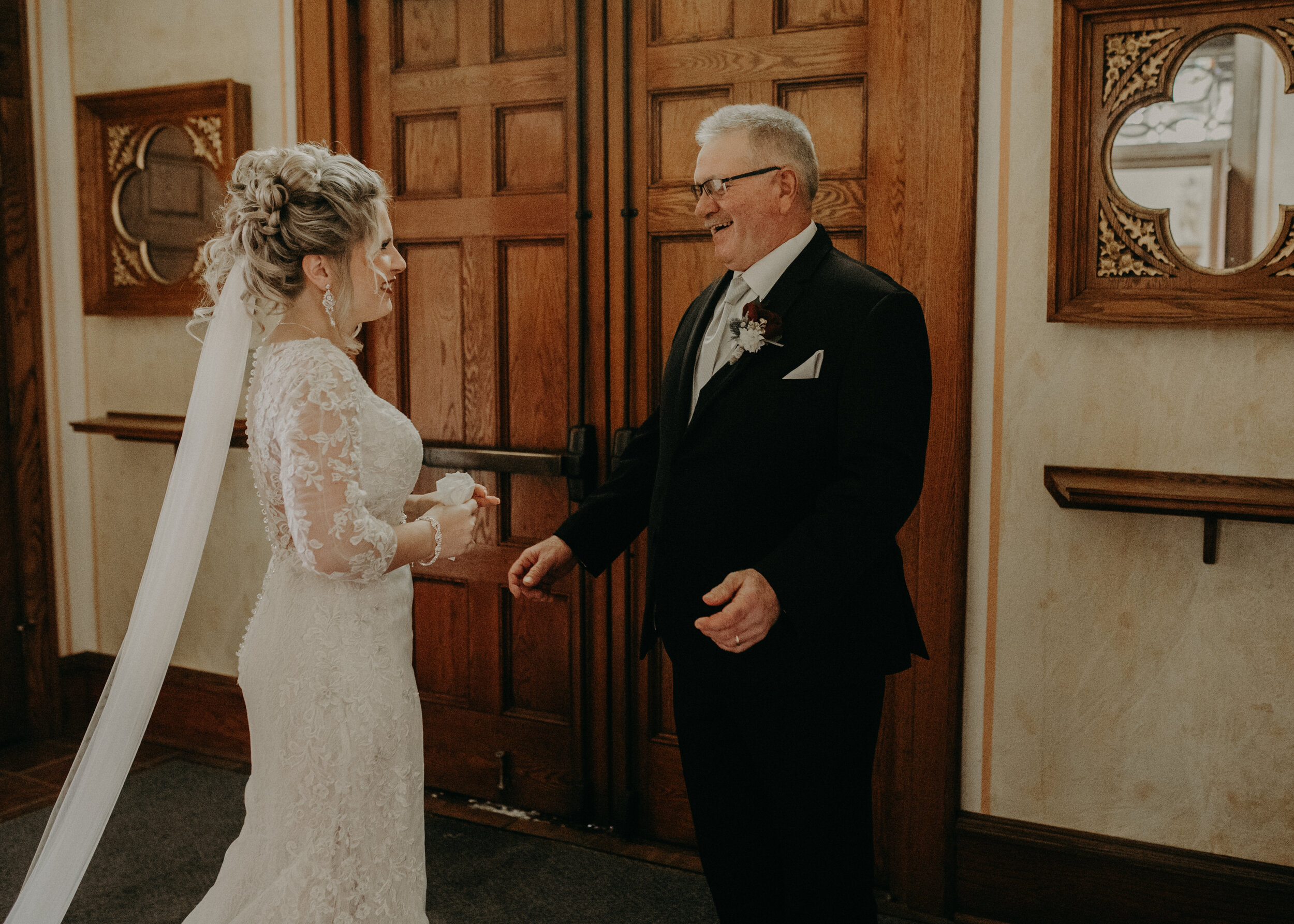  Andrea Wanger Photography cozy winter Wisconsin wedding. Perfect Wisconsin wedding in February. Elegant winter wedding bride and dad emotional first look in church. 
