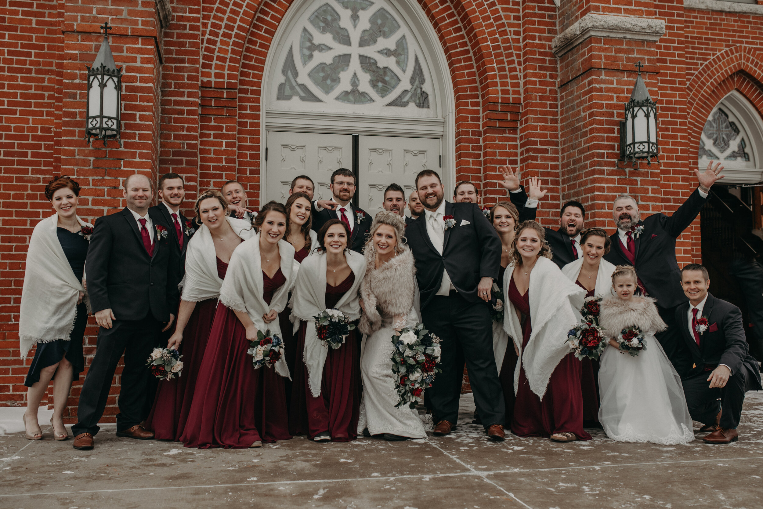  Andrea Wanger Photography cozy winter Wisconsin wedding. Perfect Wisconsin wedding in February. Elegant winter wedding. Wedding party photos outside of church. 