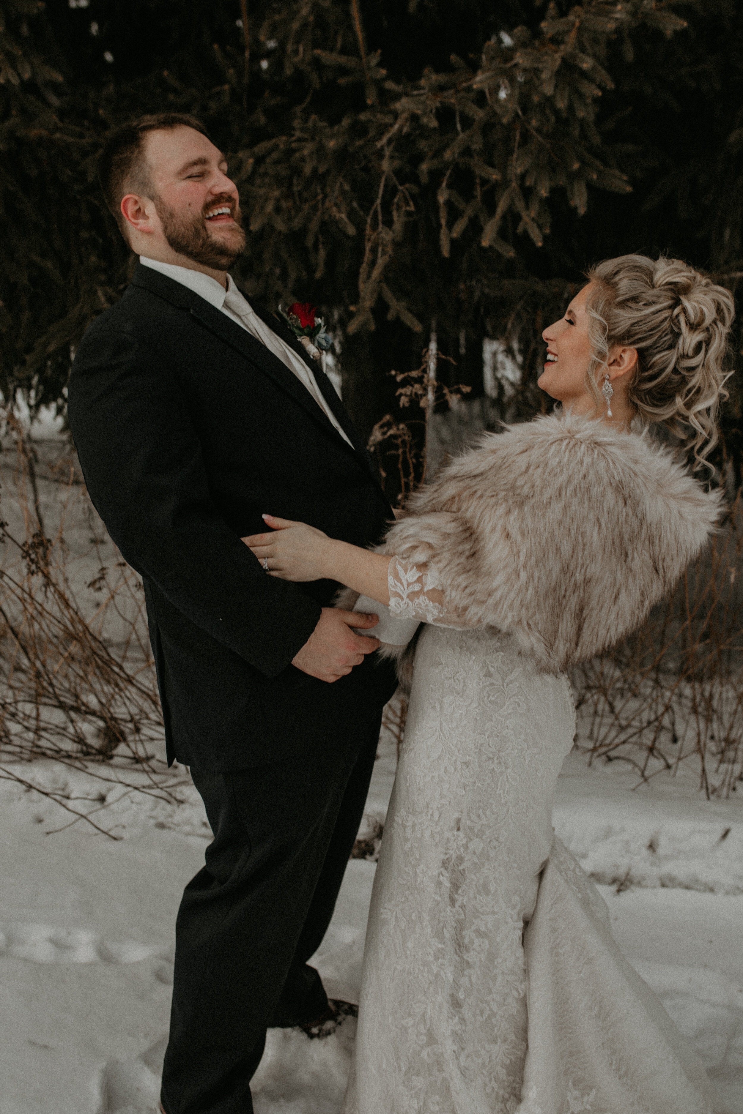  Andrea Wanger Photography cozy winter Wisconsin wedding. Perfect Wisconsin wedding in February. Elegant winter wedding bride and groom photos outside in the snow. 