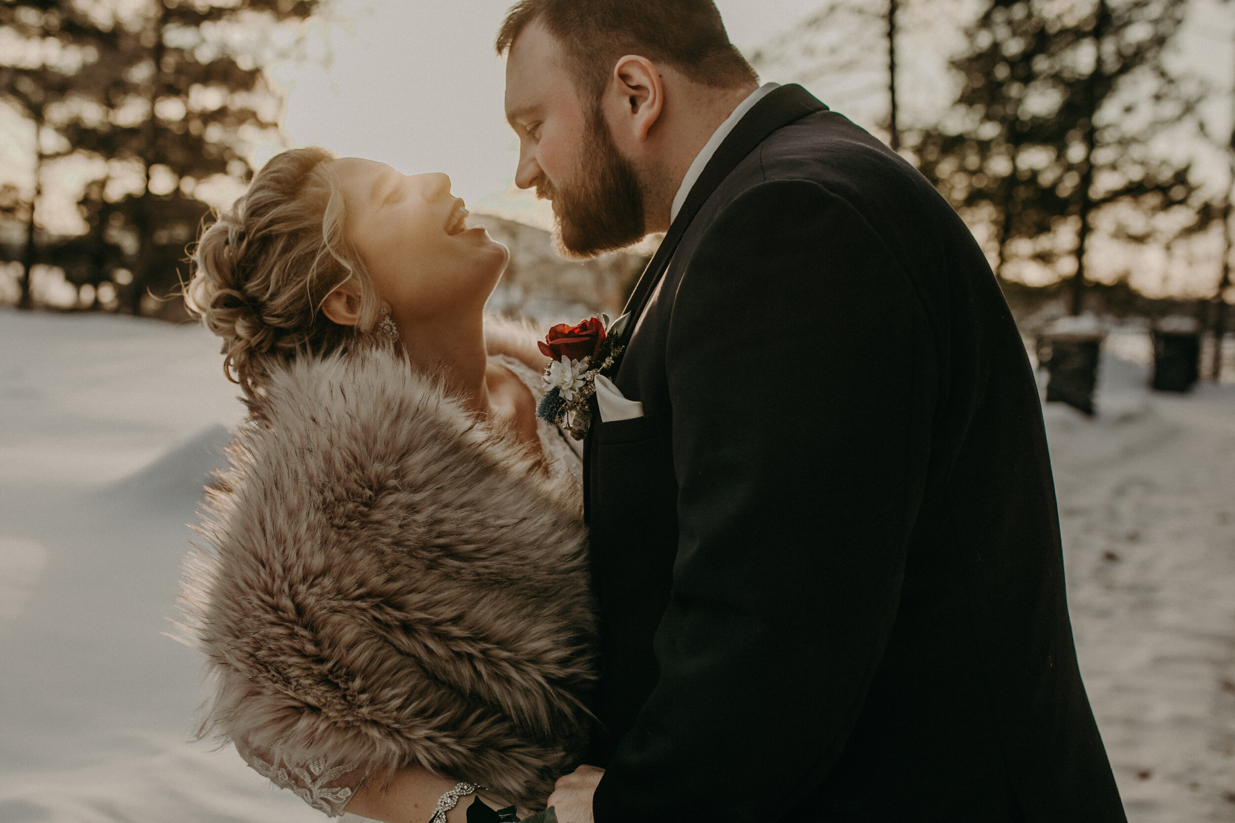  Andrea Wanger Photography cozy winter Wisconsin wedding. Perfect Wisconsin wedding in February. Elegant winter wedding bride and groom photos outside in the snow. Sunset photos. 