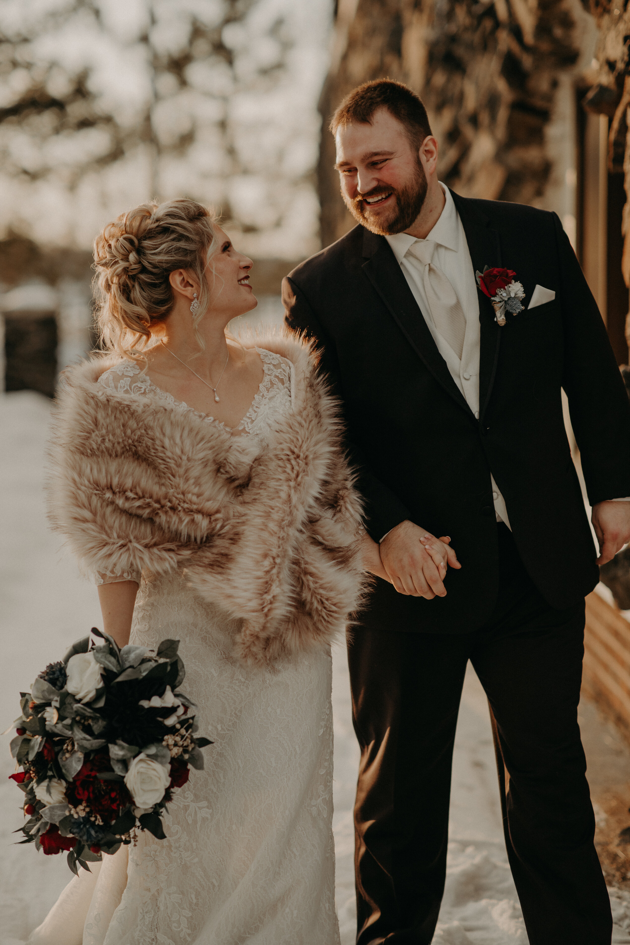  Andrea Wanger Photography cozy winter Wisconsin wedding. Perfect Wisconsin wedding in February. Elegant winter wedding bride and groom photos outside in the snow. Sunset photos. 