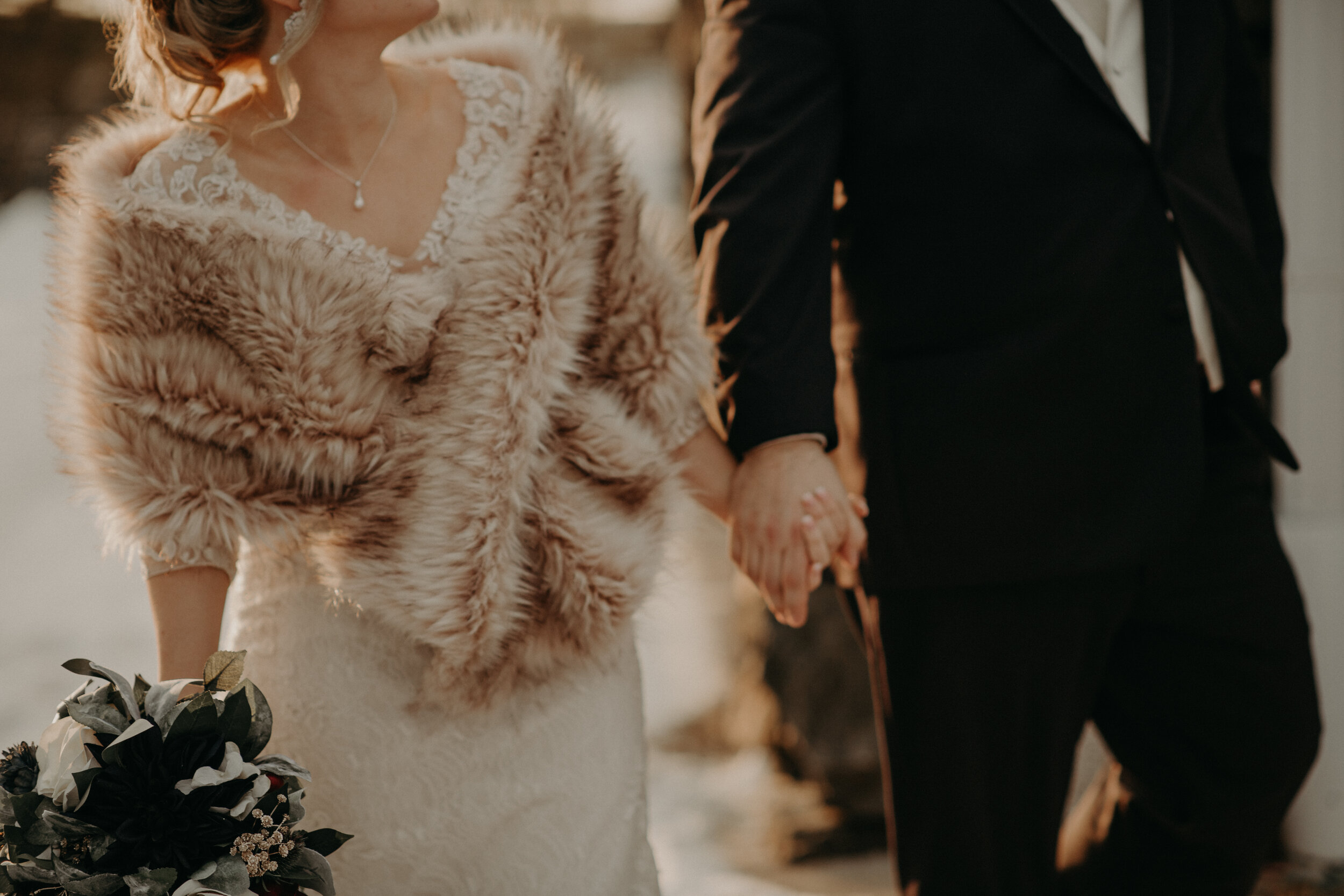  Andrea Wanger Photography cozy winter Wisconsin wedding. Perfect Wisconsin wedding in February. Elegant winter wedding bride and groom photos outside in the snow. Sunset photos. 