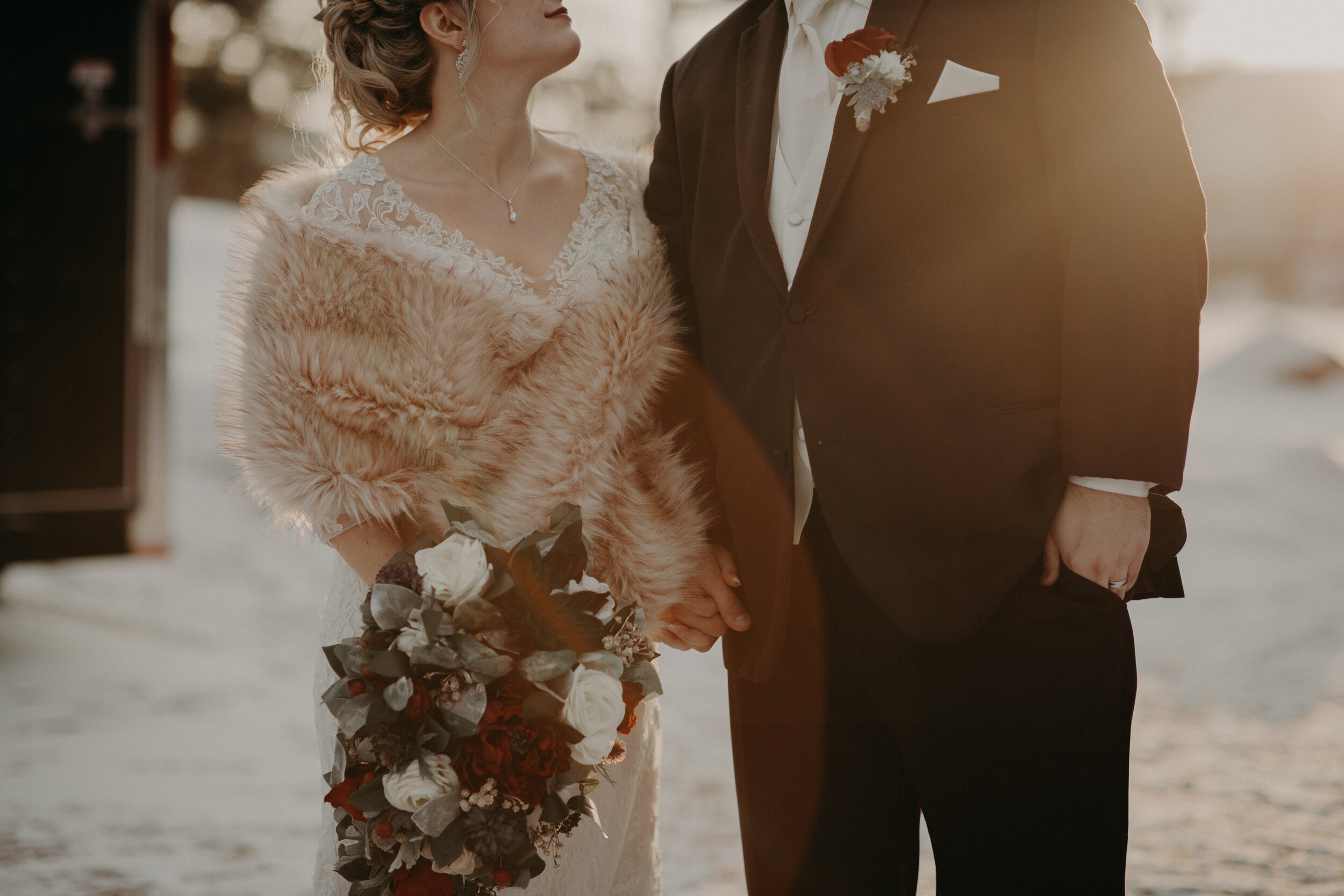  Andrea Wanger Photography cozy winter Wisconsin wedding. Perfect Wisconsin wedding in February. Elegant winter wedding bride and groom photos outside in the snow. Sunset photos. 