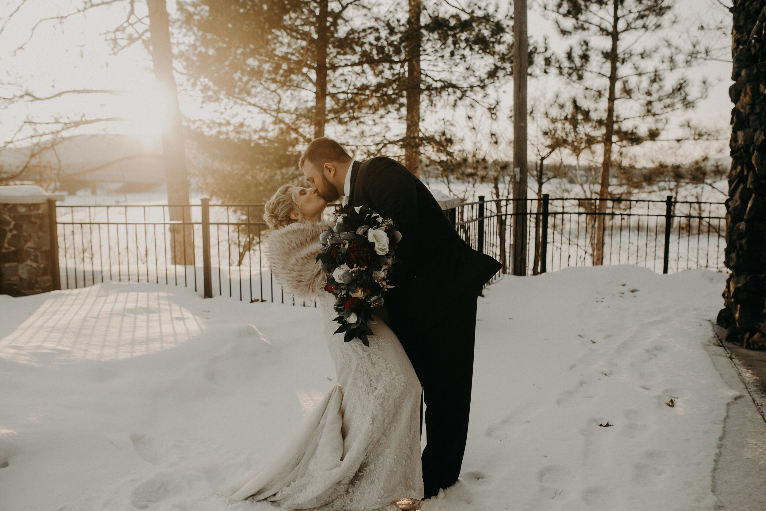  Andrea Wanger Photography cozy winter Wisconsin wedding. Perfect Wisconsin wedding in February. Elegant winter wedding bride and groom photos outside in the snow. Sunset photos. 