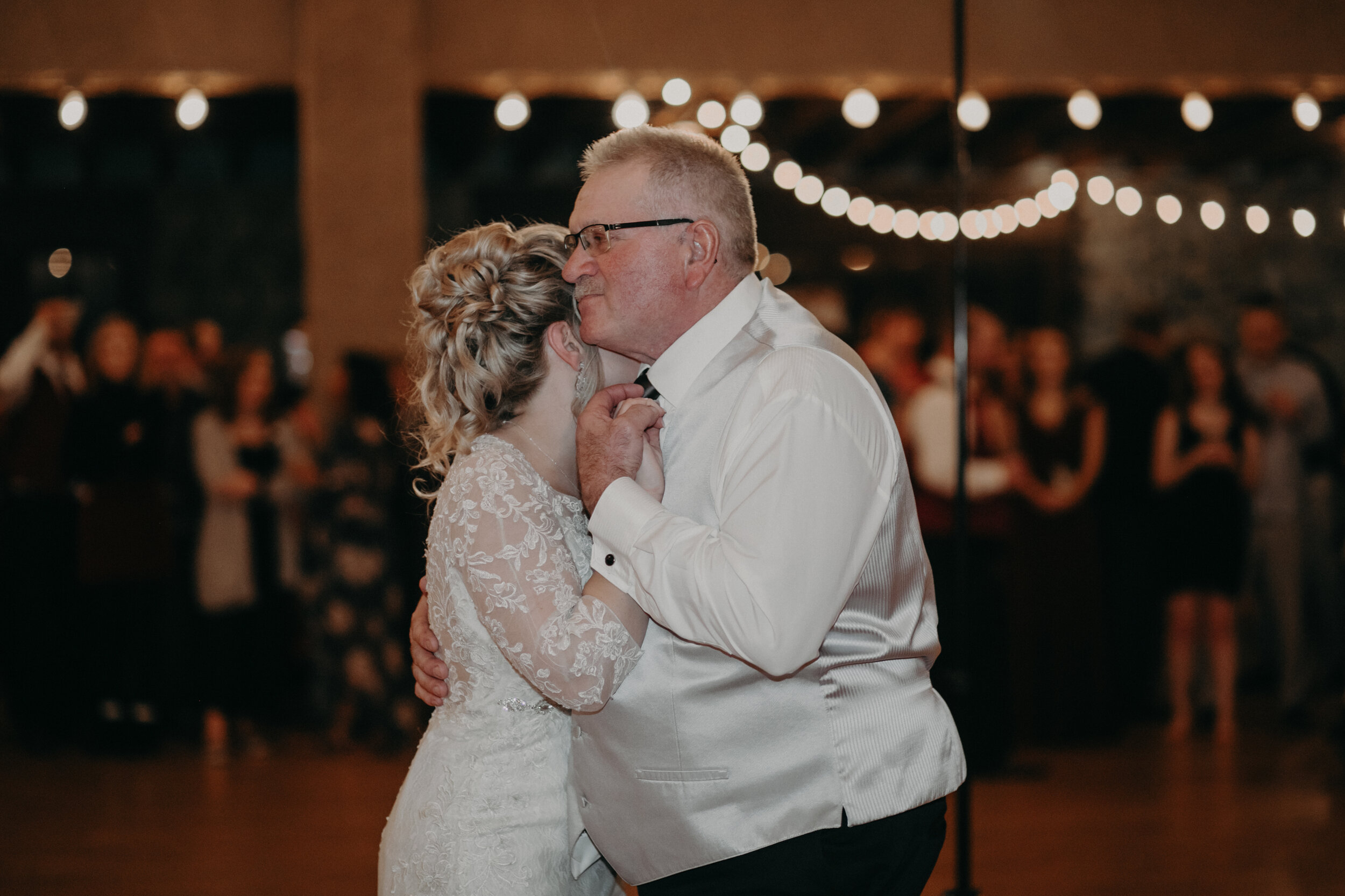  Andrea Wanger Photography cozy winter Wisconsin wedding. Perfect Wisconsin wedding in February. Elegant winter wedding. Reception father and daughter first dance. 