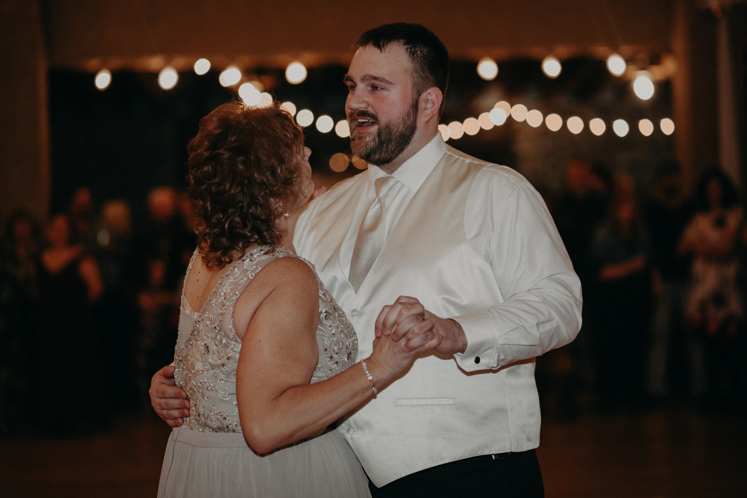  Andrea Wanger Photography cozy winter Wisconsin wedding. Perfect Wisconsin wedding in February. Elegant winter wedding. Reception mother and son first dance. 