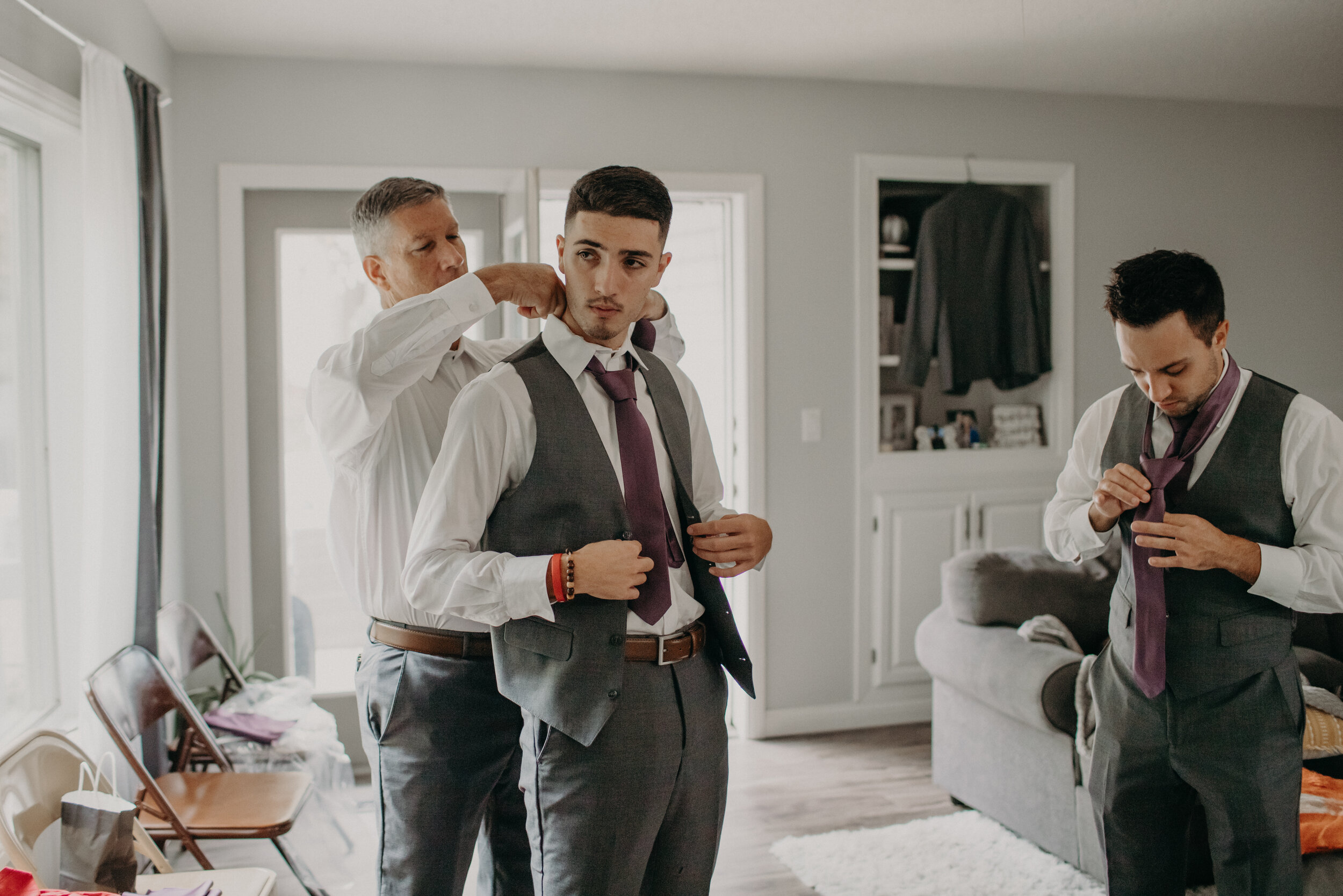  Marshfield Wedding. Marshfield Wisconsin Wedding Photographer. Marshfield WI Wedding. Marshfield Wedding Photographer. Hotel Marshfield Wedding Reception. Rainy Wedding Day in Central Wisconsin. Groom getting ready in Marshfield WI home before weddi