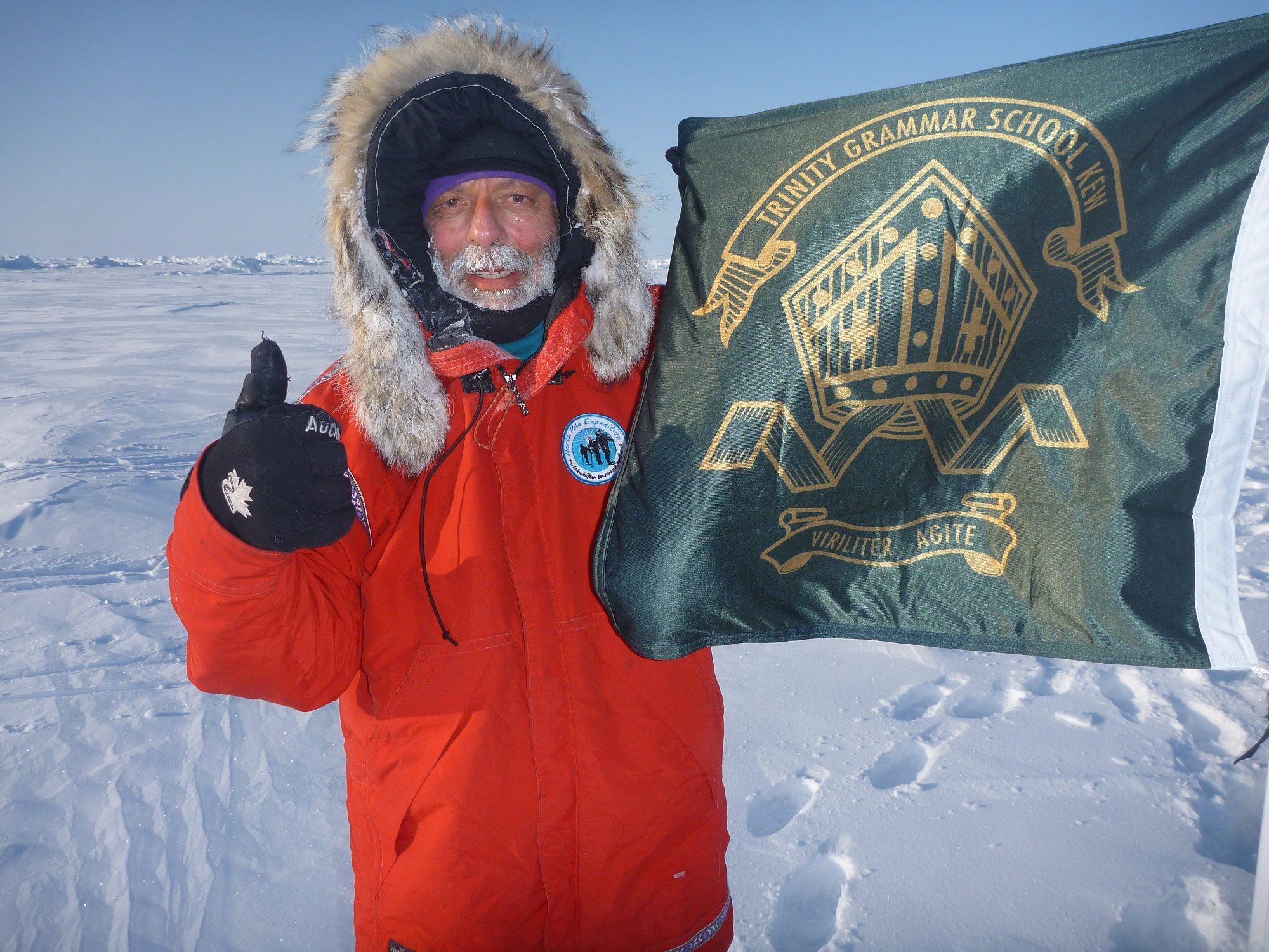 Rob Rigato planting the Trinity flag at the North Pole