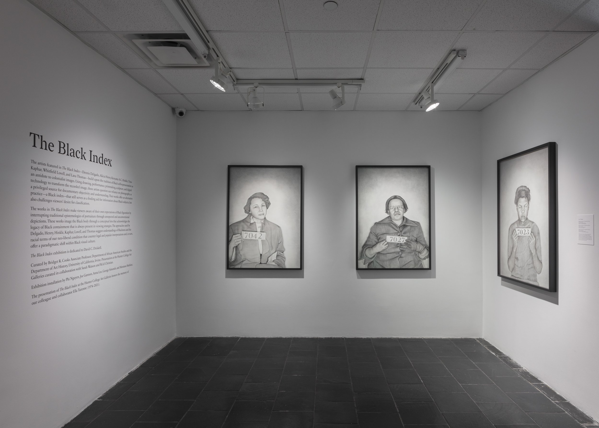  Installation view of  The Black Index  at Hunter College Art Galleries’ Leubsdorf Gallery, 2022. Photo: Stan Narten. Works by Lava Thomas, left to right:  Mugshot Portraits: Women of the Montgomery Bus Boycott, Jo Ann Robinson , 2018. Graphite and C