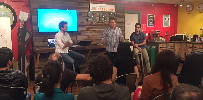 Guillaume de Dorlodot, Chris Haroun and Rigley Dutra presenting to startups at a venture capital event hosted by Startup Basecamp.