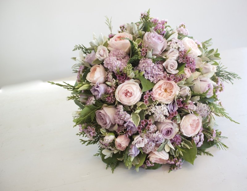 pink and lilac posy pad funeral flowers.jpeg