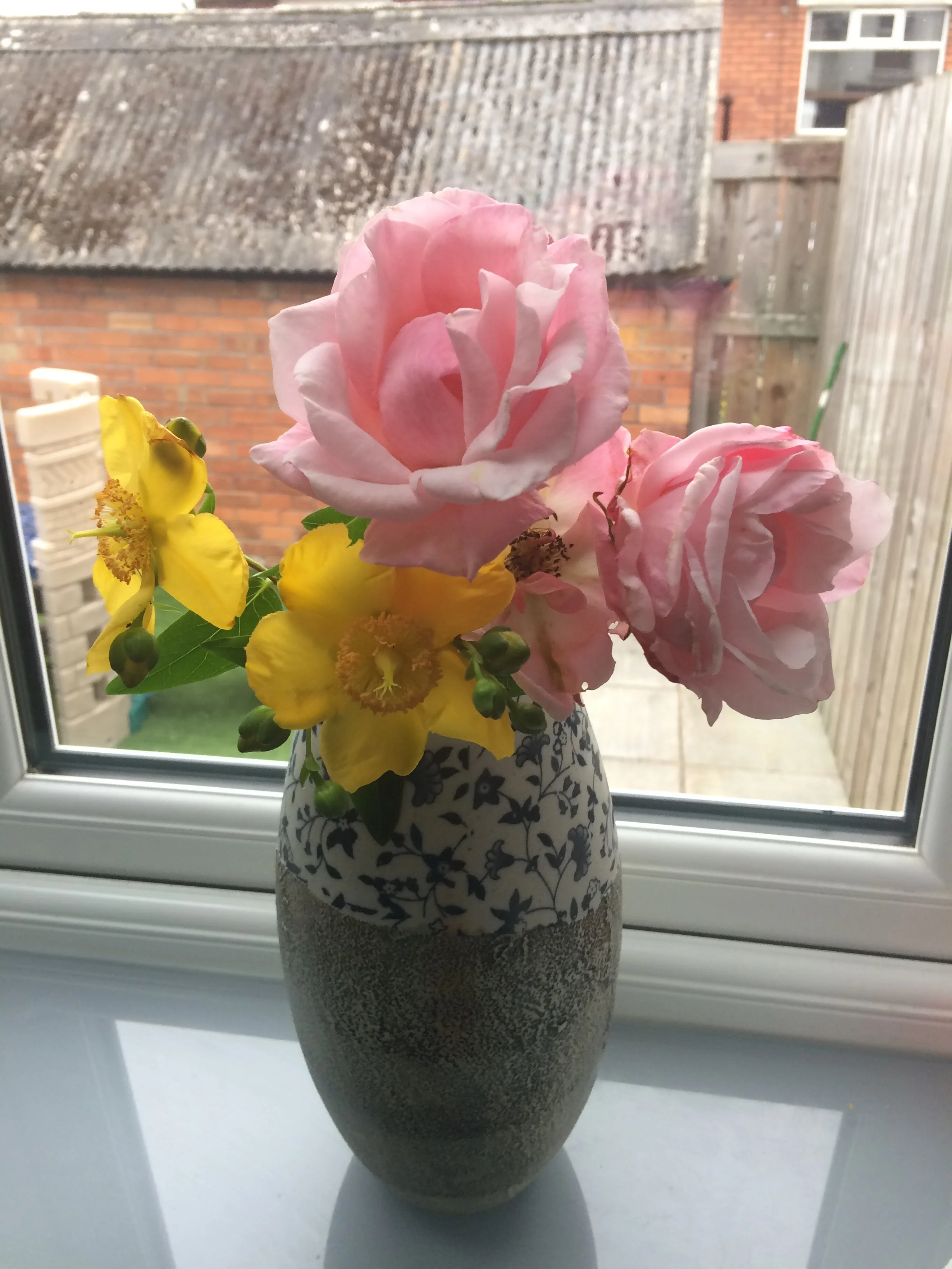 the flowers cut from our own garden, no thanks to my own hands