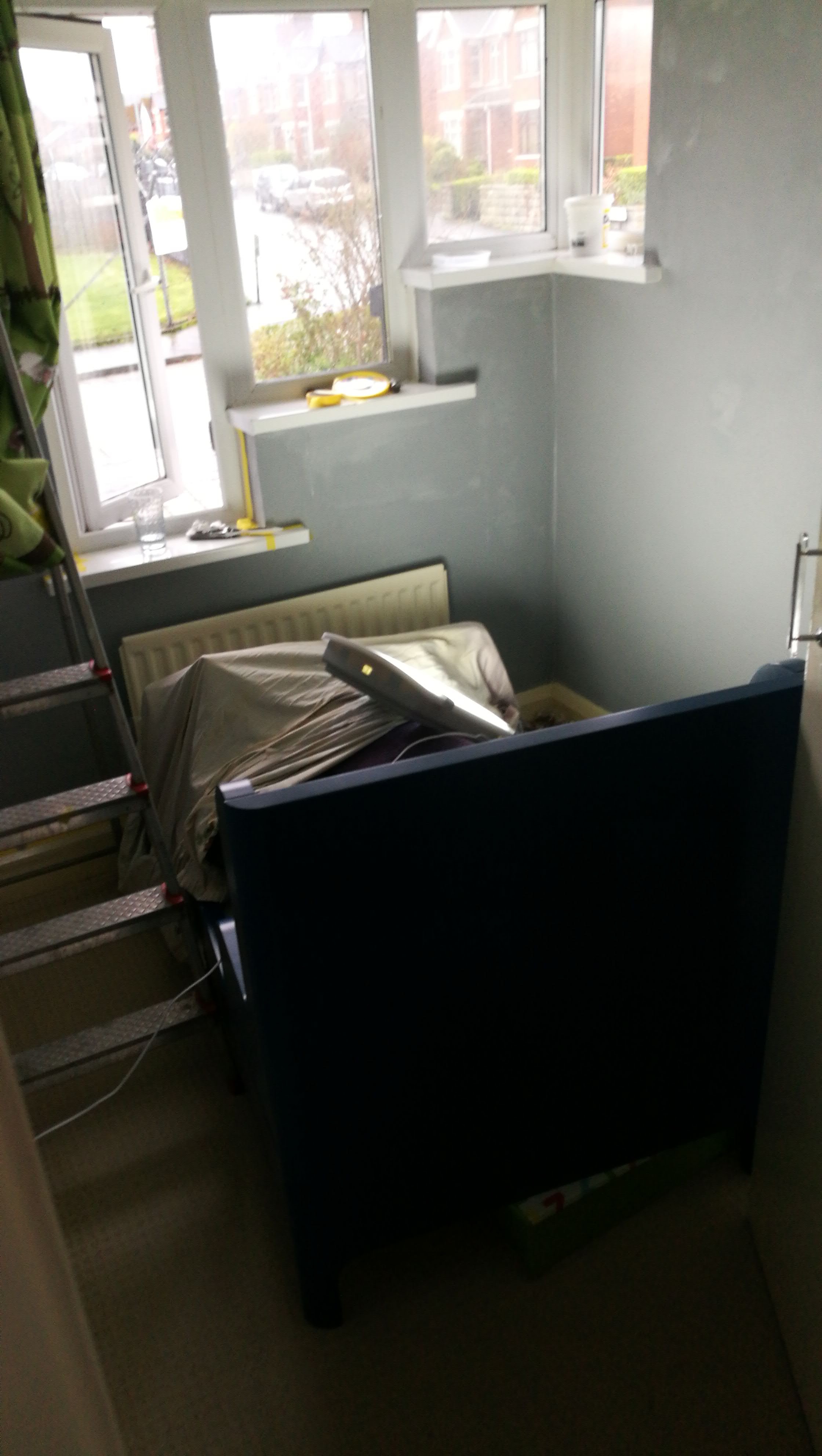 Mid-paint. It's a tiny room so his small bed just got shuffled about while I painted!