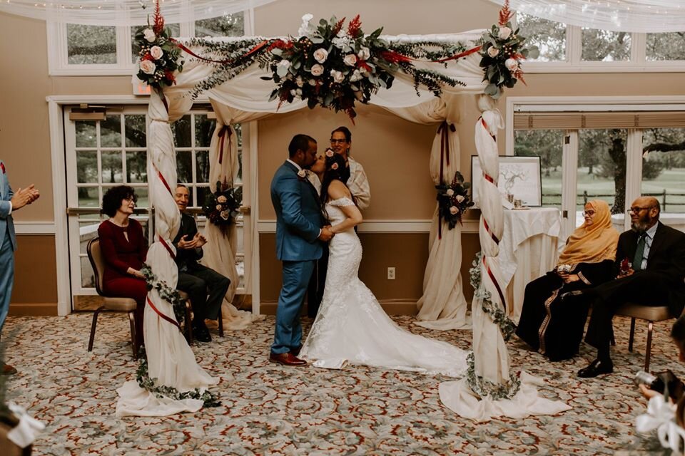 Jewish & Muslim parents sit just beyond the chuppah at this wedding of groom who self-identifies as 