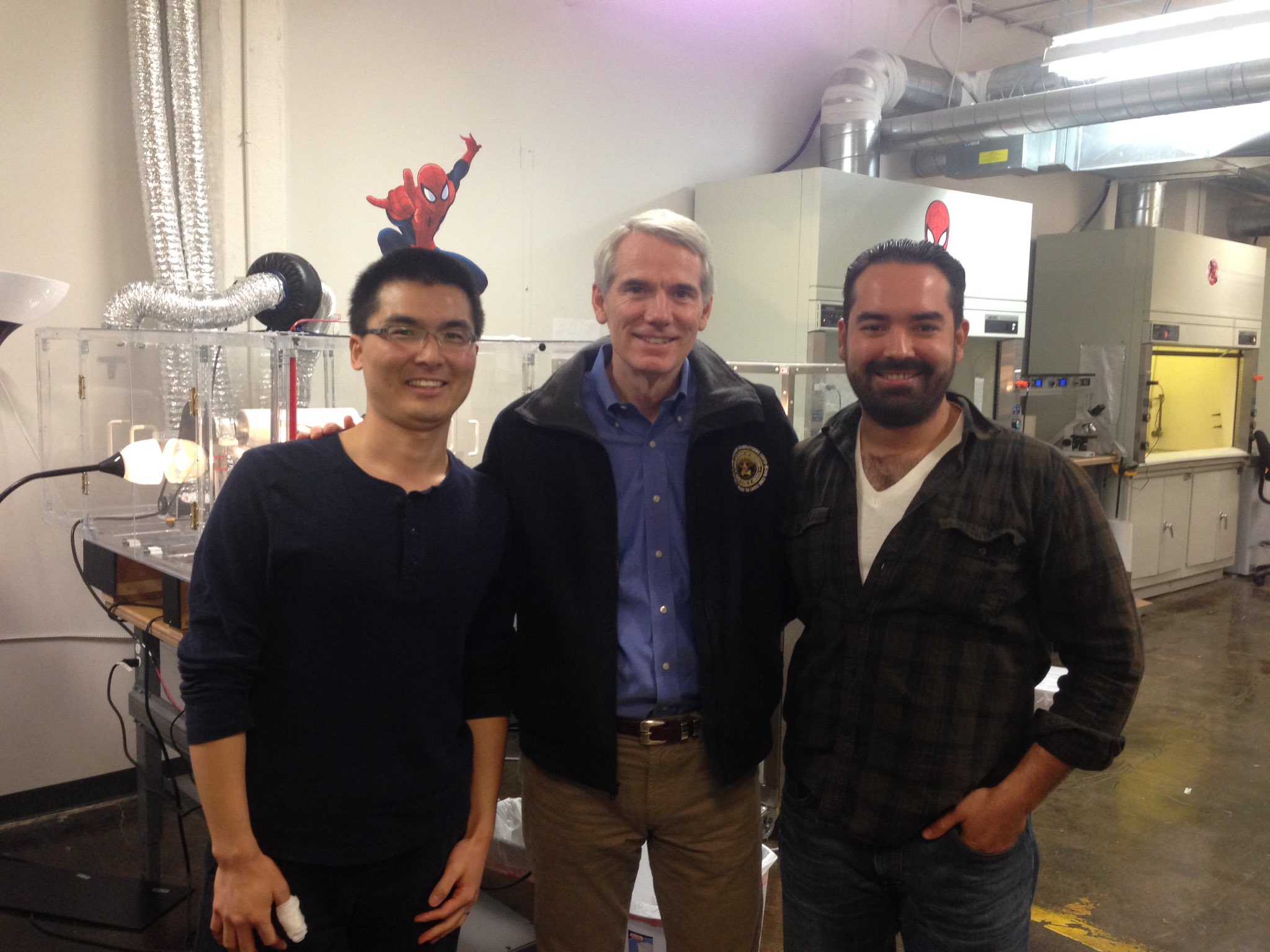 AAI's Dr. Fei Wang and Ali Blandon give Senator Rob Portman a lab tour at the Akron Accelerator.