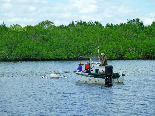 Judith and Damien on a research vessel