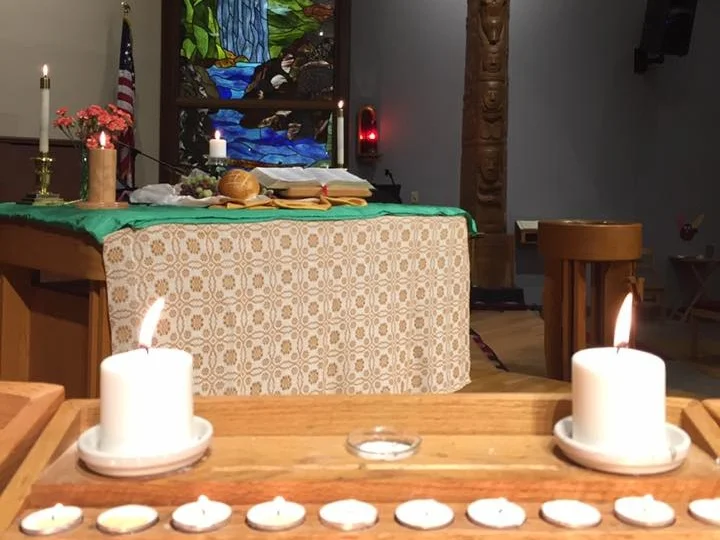all+saints+candels+with+stained+glass+and+totem+pole.jpg