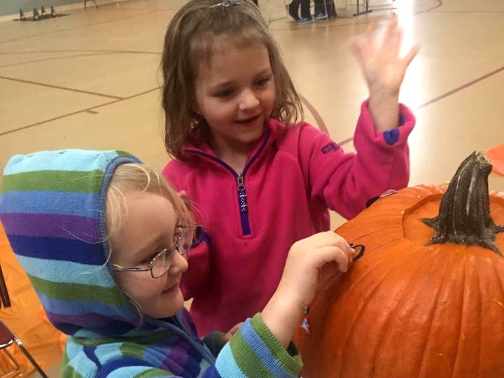 haddie+and+clara+decorating+pumpkin.jpg