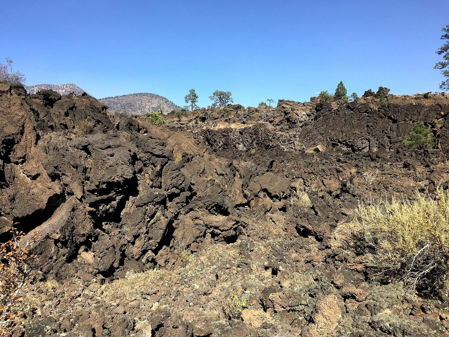 Wrestling with templates, coding, internet issues, etc. is like being in the midst of this lava flow - it's sharp, brittle, unforgiving, nasty stuff.