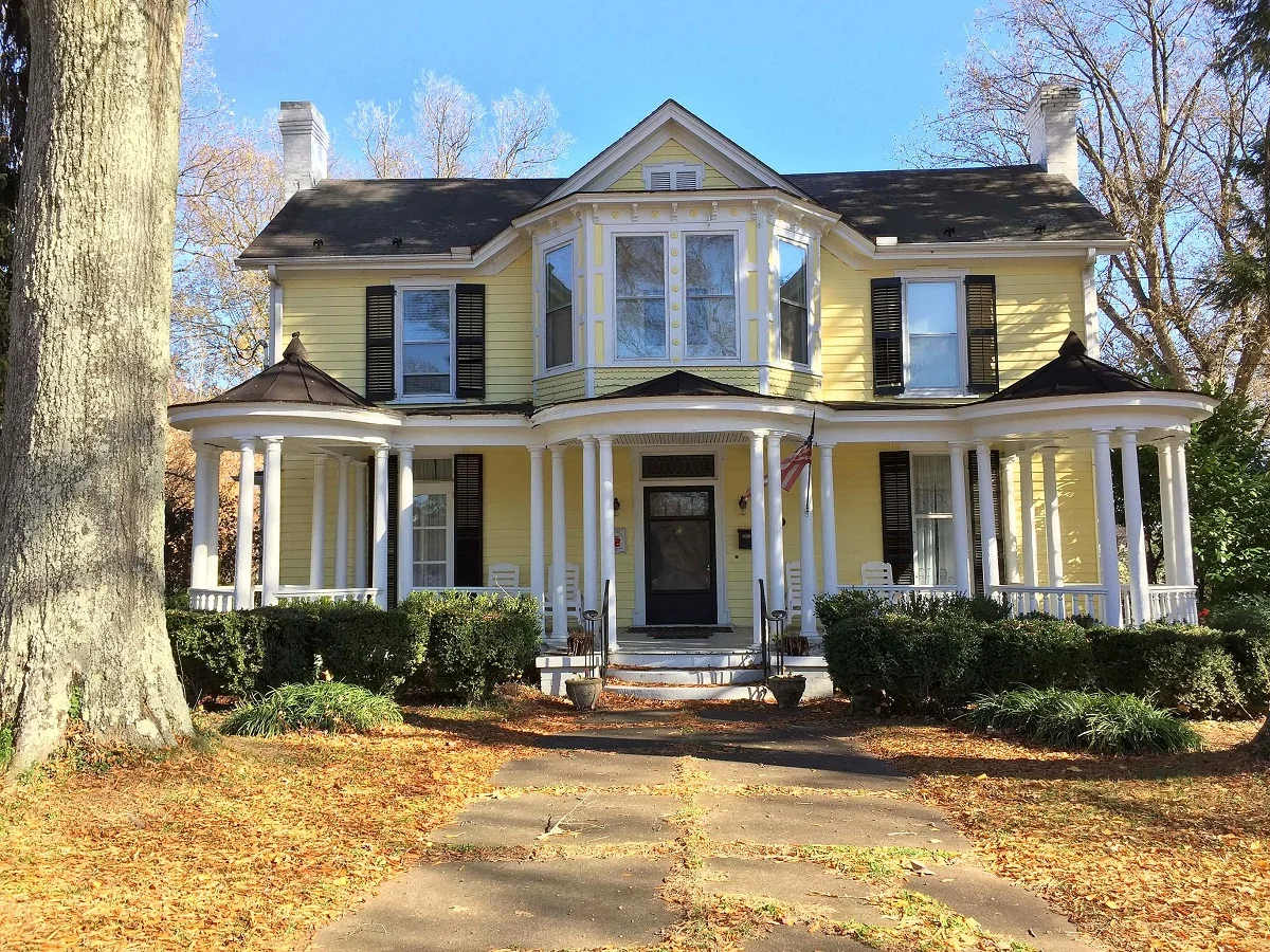 This mightbe a Queen Anne Victorian. Gracious!
