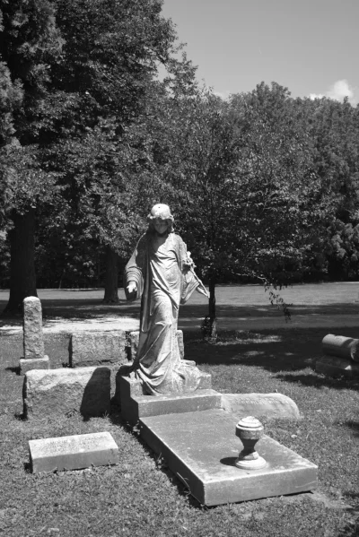This is the angel statue to the right of the Dimick gravesite. (And don't worry, there will be more posts coming exploring some of the other gravestones at Chippiannock!)