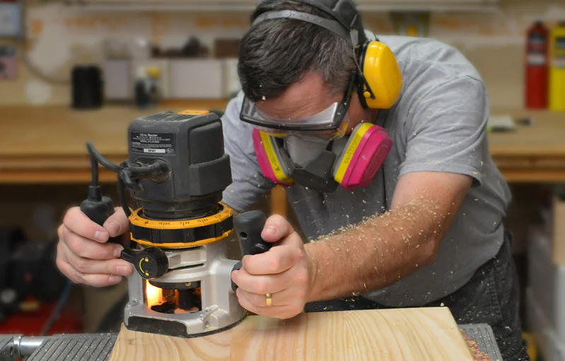 Shown with an optional arm-hair, sawdust-catching feature.